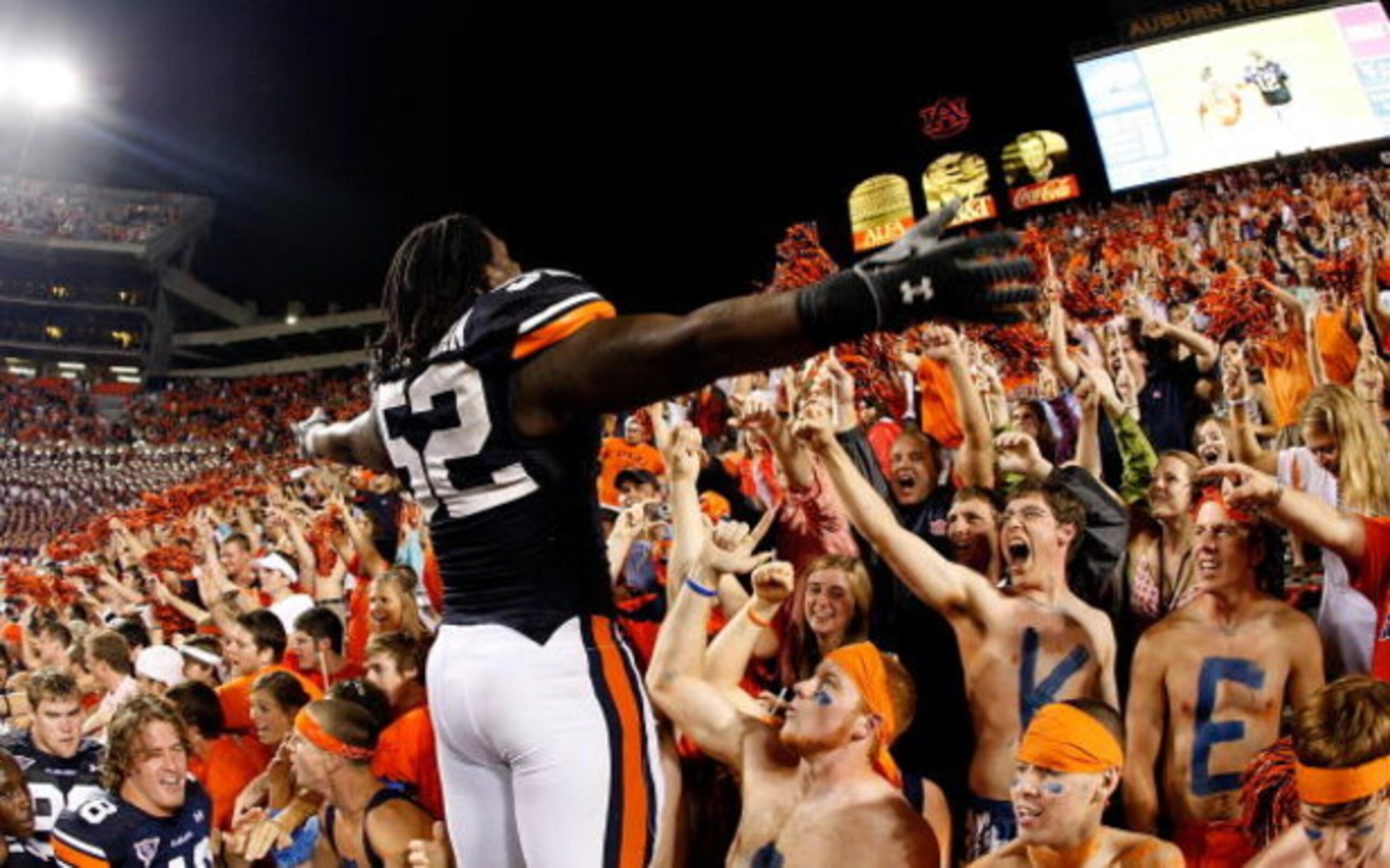 AUBURN, AL - SEPTEMBER 19:  Antonio Coleman #52 of the Auburn Tigers cheers with the fans against the West Virginia Mountaineers at Jordan-Hare Stadium on September 19, 2009 in Auburn, Alabama.  (Photo by Kevin C. Cox/Getty Images)