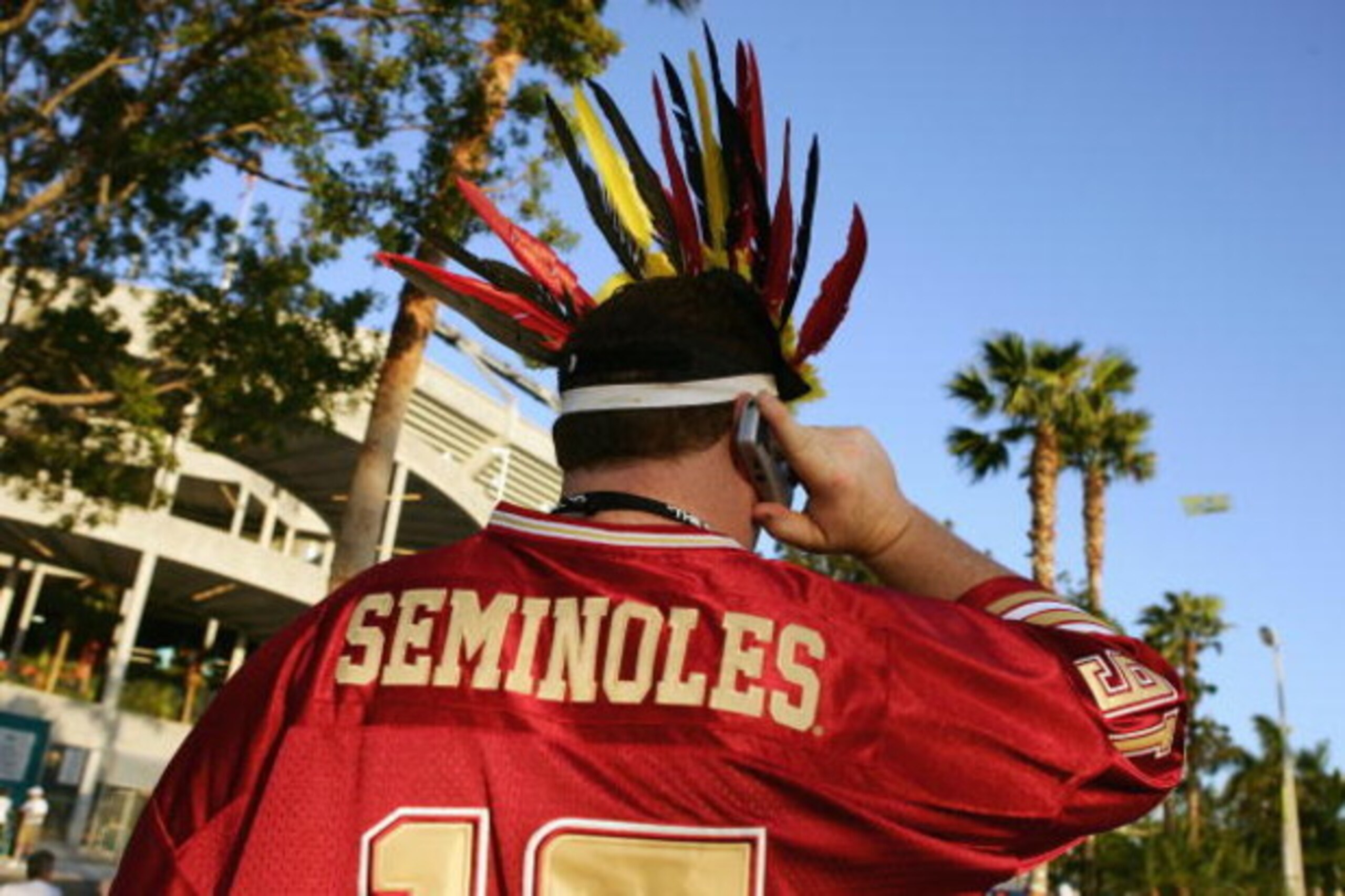 MIAMI GARDENS, FL - JANUARY 3:  A Florida State Seminoles fan talks on his cell phone before  the Fed Ex Orange Bowl with the Penn State Nittany Lions at Dolphins Stadium on January 3, 2005 in Miami Gardens, Florida. The Lions won 26-23 in triple overtime