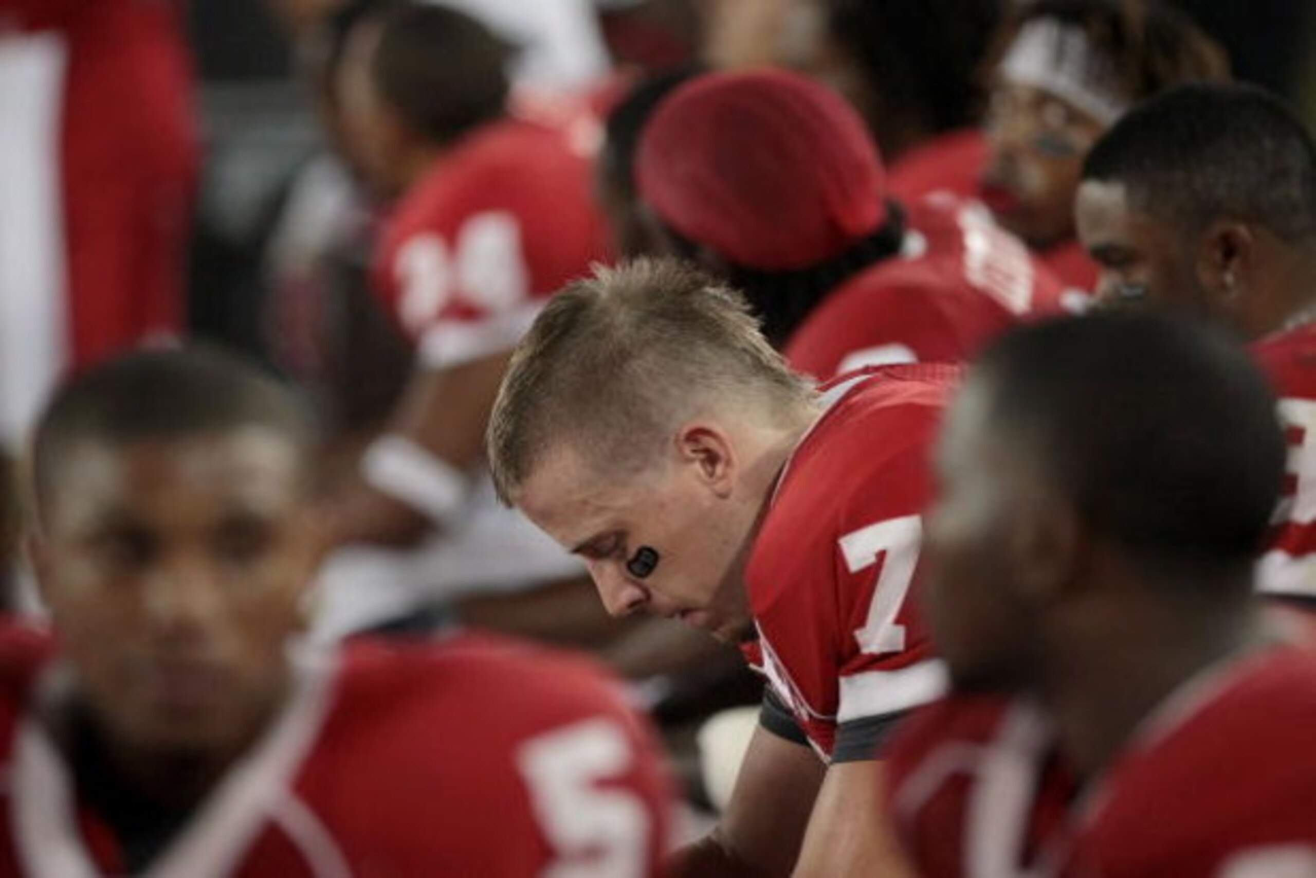 HOUSTON - SEPTEMBER 26: Quarterback Case Keenum #7 of the Houston Cougars sits on the bench while UH plays against the Texas Tech Red Raiders at Robertson Stadium on September 26, 2009 in Houston, Texas.  (Photo by Thomas B. Shea/Getty Images)