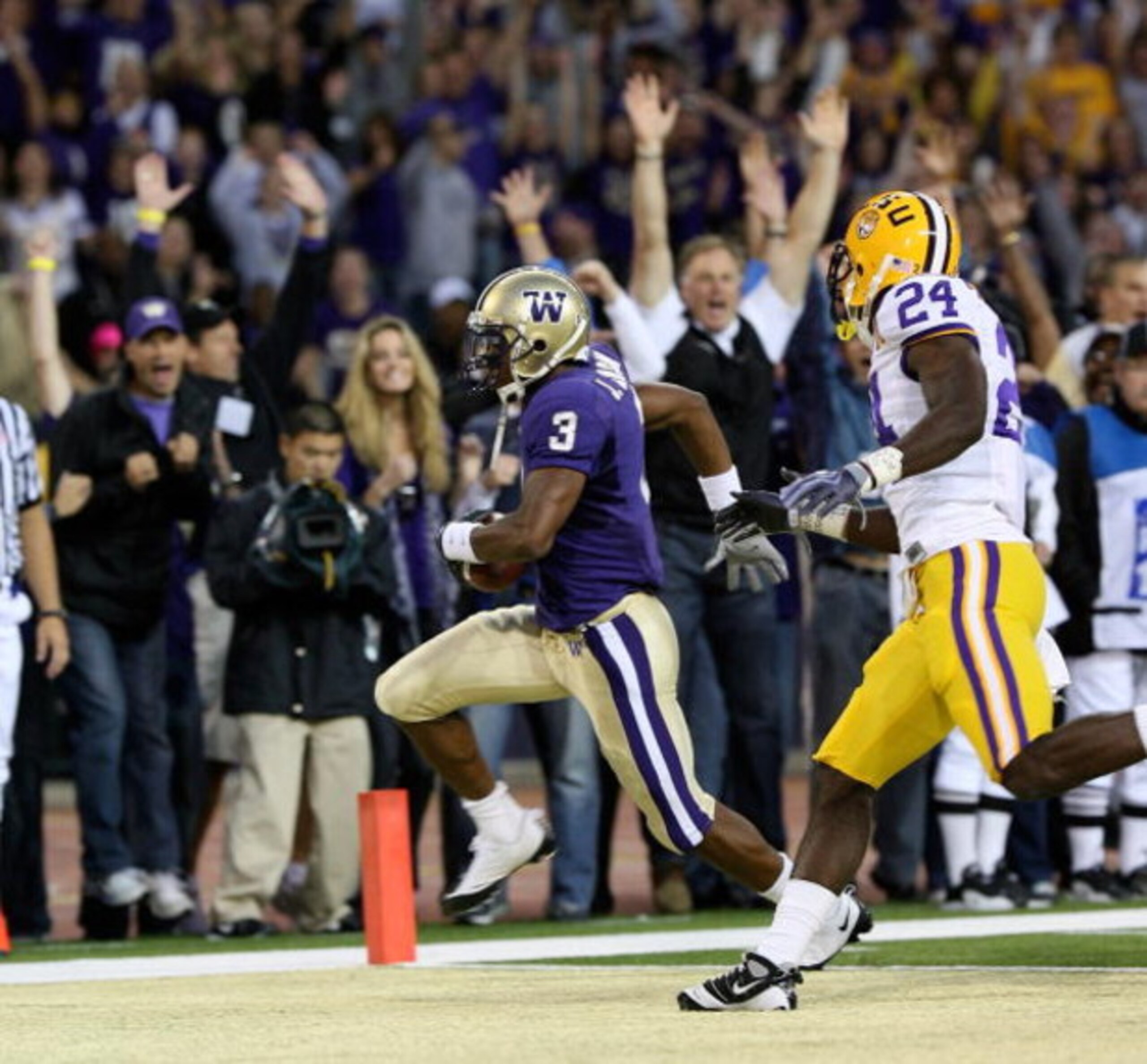 SEATTLE - SEPTEMBER 05:  Wide receiver James Johnson #3 of the Washington Huskies scores a touchdown past Harry Coleman #24 of the LSU Tigers on September 5, 2009 at Husky Stadium in Seattle, Washington. (Photo by Otto Greule Jr/Getty Images)