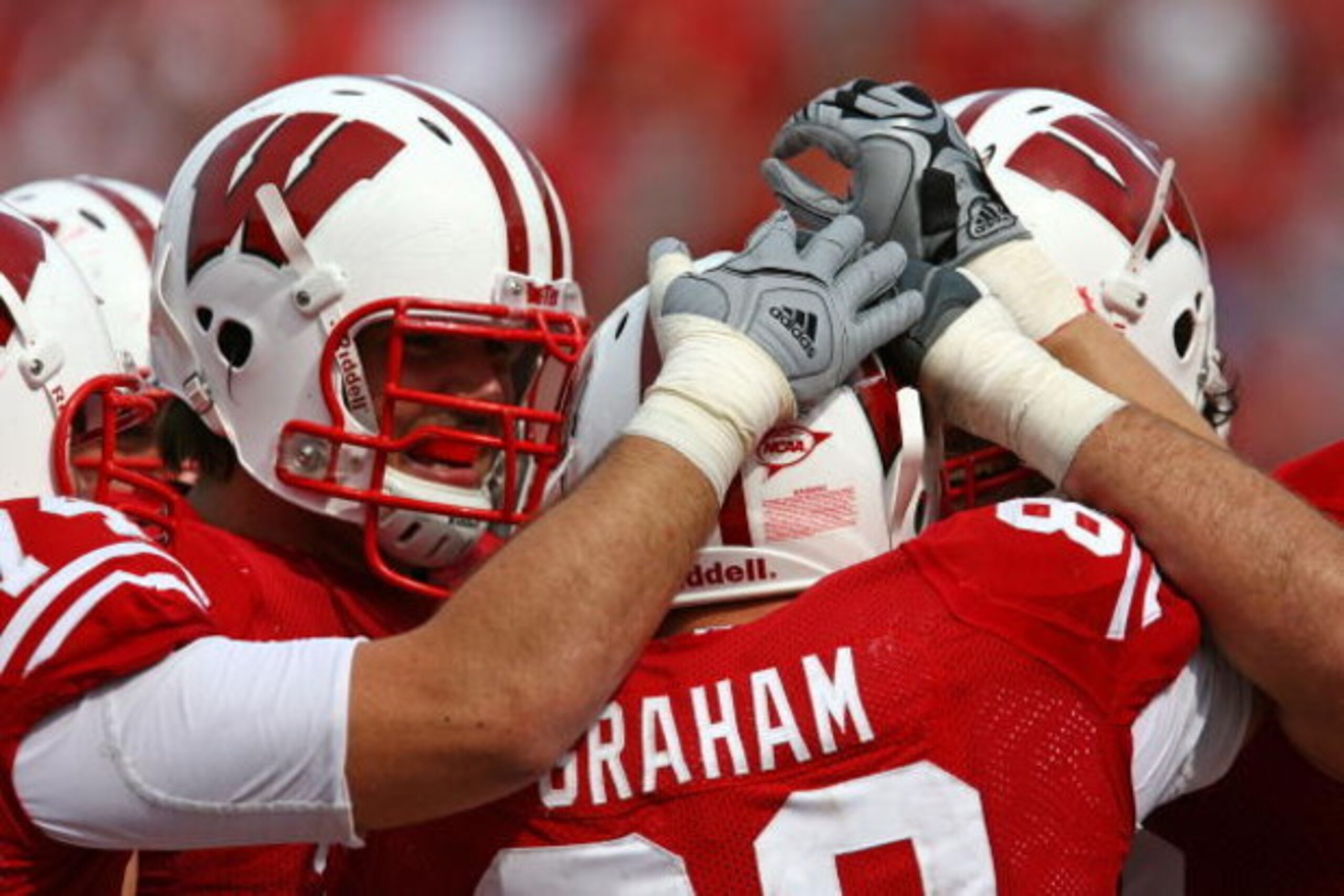 MADISON, WI - SEPTEMBER 26: Garrett Graham #89 of the Wisconsin Badgers is congratulated by teammates after catching his third touchdown pass against the Michigan State Spartans on September 26, 2009 at Camp Randall Stadium in Madison, Wisconsin. Wisconsi