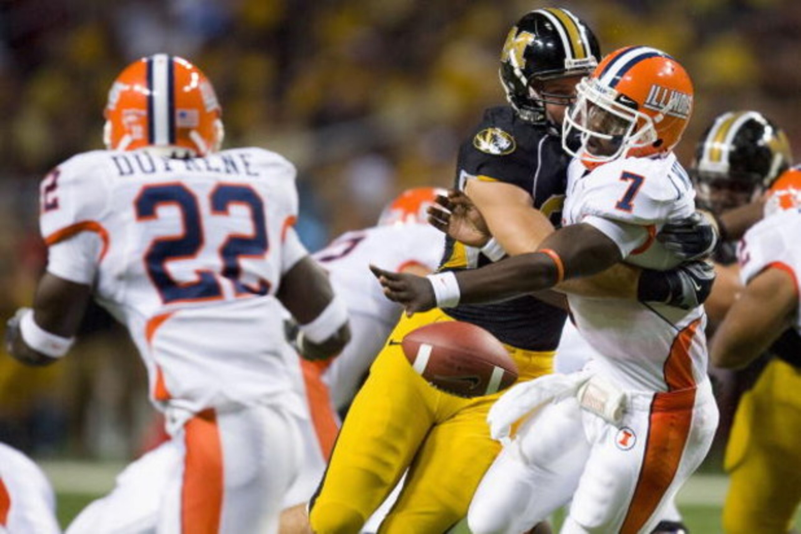 ST. LOUIS, MO - AUGUST 30: Juice Williams #7 of the University of Illinois Fighting Illini has the ball knocked loose against the University of Missouri Tigers during the State Farm Arch Rivalry game at the Edward Jones Dome on August 30, 2008 in St. Loui
