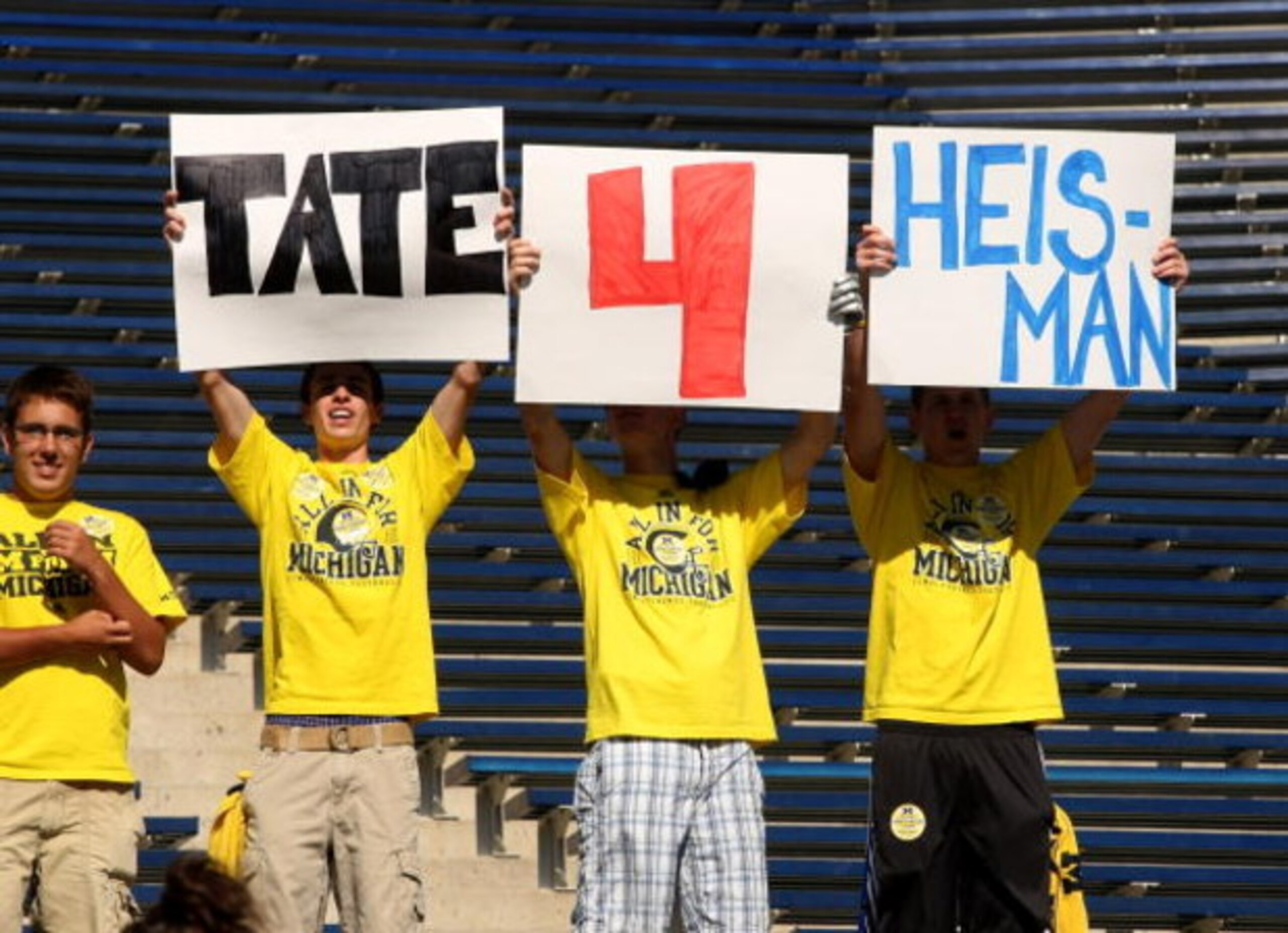 ANN ARBOR, MI - SEPTEMBER 19:  Fans of quarterback Tate Forcier #5 of the Michigan Wolverines hold signs promoting him before the game against the Eastern Michigan Eagles at Michigan Stadium on September 19, 2009 in Ann Arbor, Michigan.   Michigan won 45-
