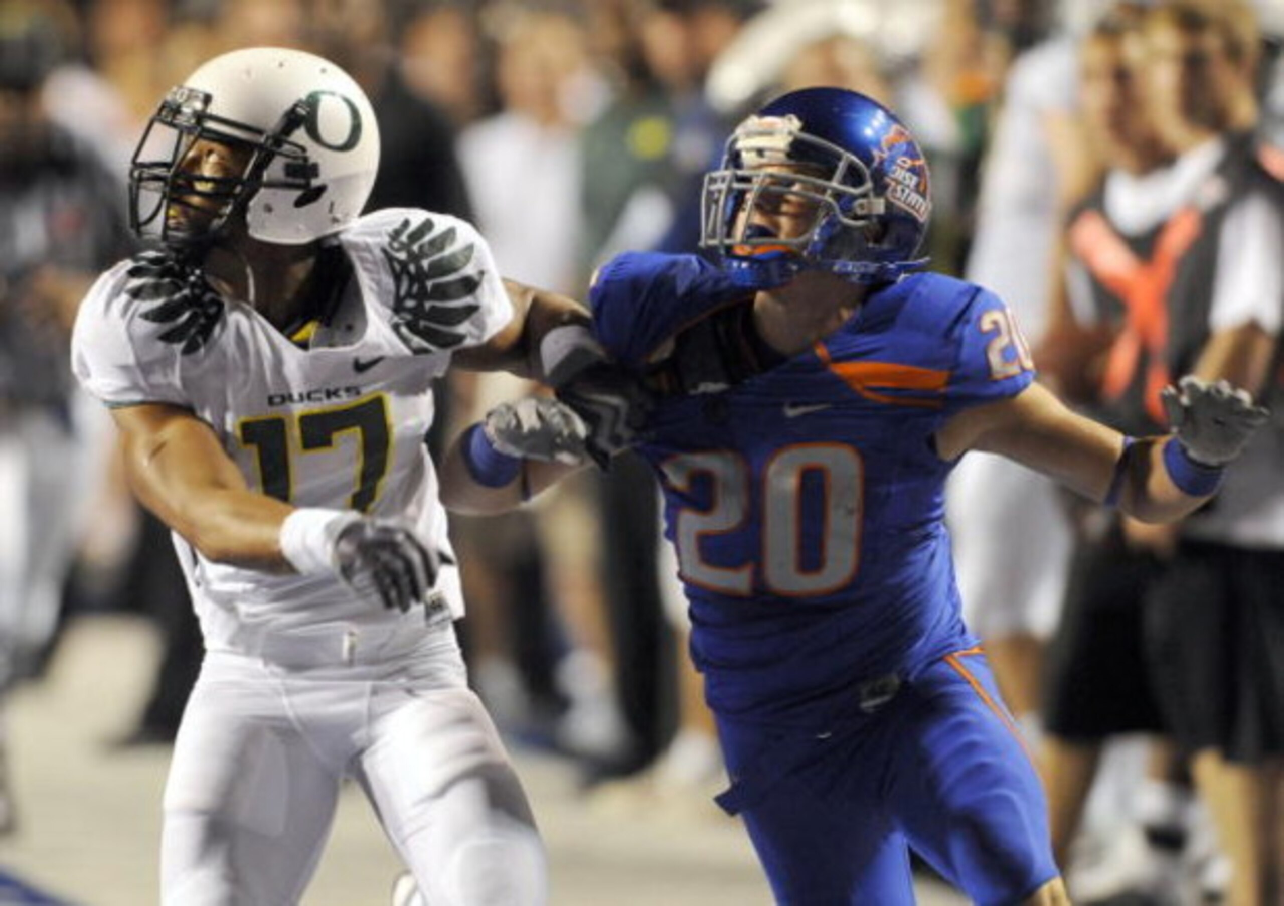 BOISE, ID - SEPTEMBER 3:  Willie Glasper #17 of the Oregon Ducks battles for position with Mitch Burroughs #20 of the Boise State as a pass is thrown in second quarter of the game on September 3, 2009 at Broncos Stadium in Boise, Idaho. Boise State won th