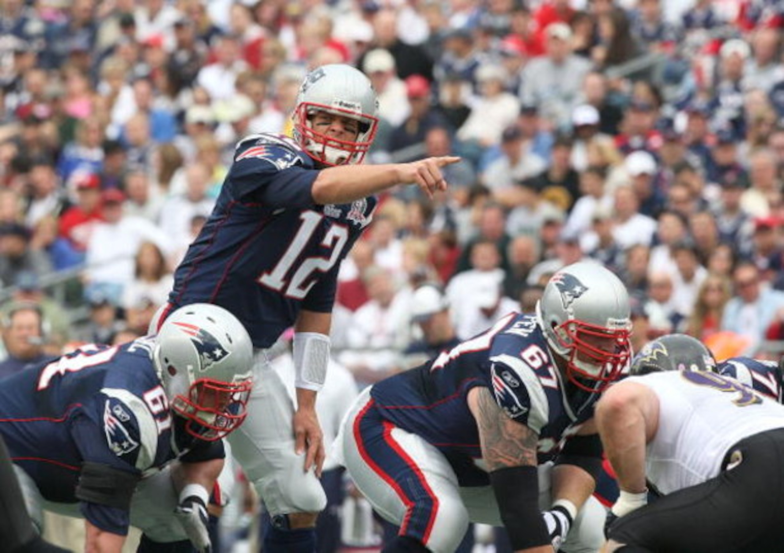 FOXBORO, MA - OCTOBER 4:  Tom Brady #12 of the New England Patriots gestures during a game against the Baltimore Ravens at Gillette Stadium on October 4, 2009 in Foxboro, Massachusetts. (Photo by Jim Rogash/Getty Images)