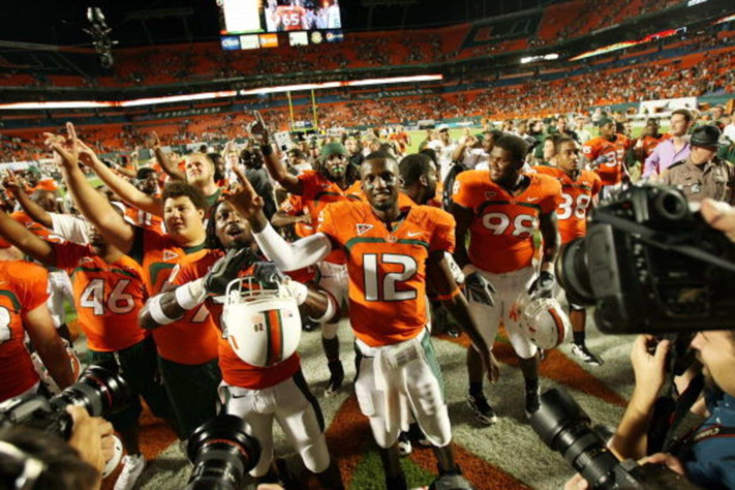 FORT LAUDERDALE, FL - OCTOBER 03: Quarterback Jacory Harris #12 of the Miami Hurricanes celebrates with teammates after a victory over the Oklahoma Sooners at Land Shark Stadium on October 3, 2009 in Fort Lauderdale, Florida. Miami defeated Oklahoma 21-20 FORT LAUDERDALE, FL - OCTOBER 03: Quarterback Jacory Harris #12 of the Miami Hurricanes celebrates with teammates after a victory over the Oklahoma Sooners at Land Shark Stadium on October 3, 2009 in Fort Lauderdale, Florida. Miami defeated Oklahoma 21-20