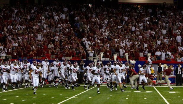 ATLANTA - SEPTEMBER 05:  Head coach Nick Saban (R) of the Alabama Crimson Tide leads his team on the field to face the Virginia Tech Hokies during the Chick-fil-A Kickoff Game at Georgia Dome on September 5, 2009 in Atlanta, Georgia.  (Photo by Kevin C. C