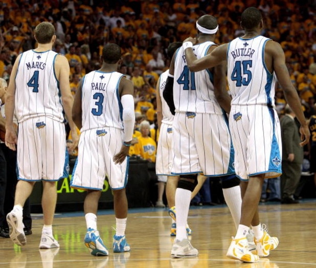 NEW ORLEANS - APRIL 25:  (L-R) Sean Marks #4, Chris Paul #4,James Posey #41 and Rasual Butler #45 of the New Orleans Hornets walk across the court during Game Three of the Western Conference Quarterfinals against the Denver Nuggets during the 2009 NBA Pla