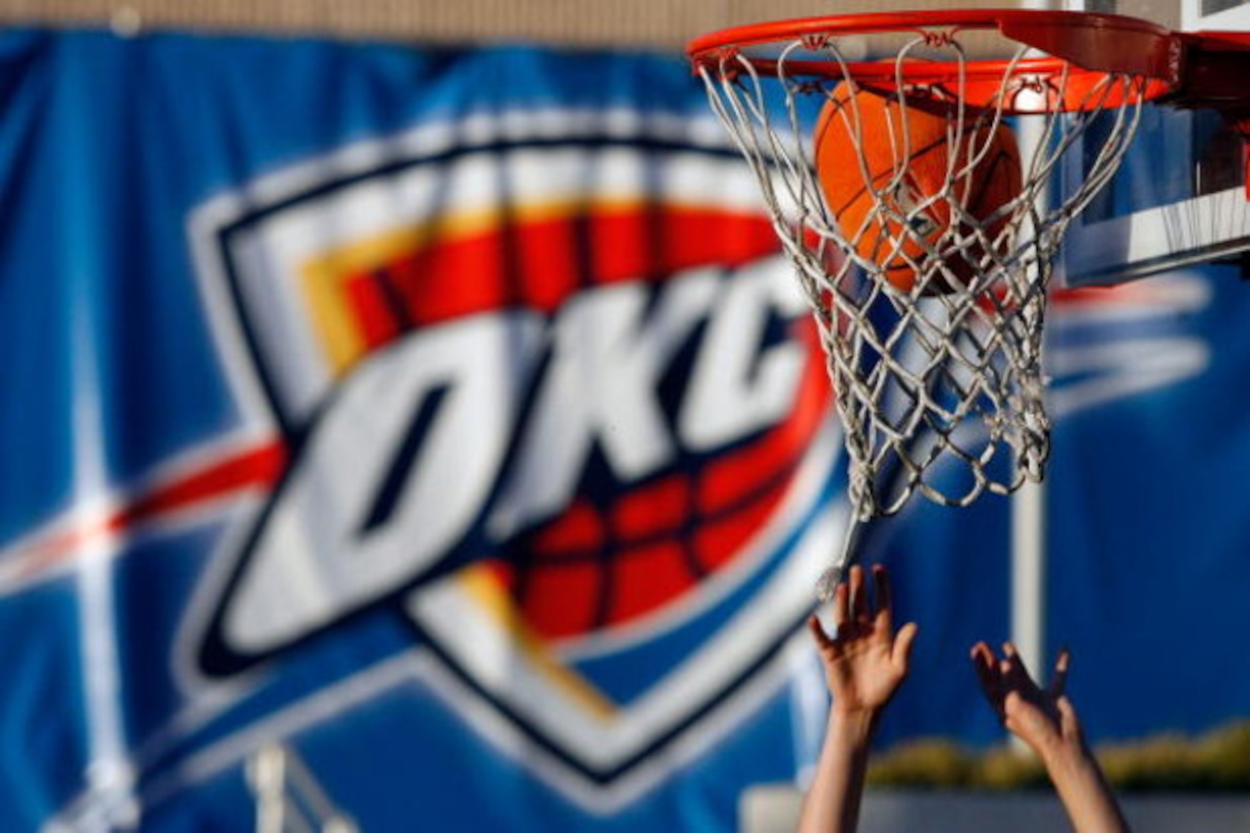 OKLAHOMA CITY - OCTOBER 29: A fan plays basketball outside before the Milwaukee Bucks play the Oklahoma City Thunder at the Ford Center on October 29, 2008 in Oklahoma City, Oklahoma. NOTE TO USER: User expressly acknowledges and agrees that, by download OKLAHOMA CITY - OCTOBER 29: A fan plays basketball outside before the Milwaukee Bucks play the Oklahoma City Thunder at the Ford Center on October 29, 2008 in Oklahoma City, Oklahoma. NOTE TO USER: User expressly acknowledges and agrees that, by download