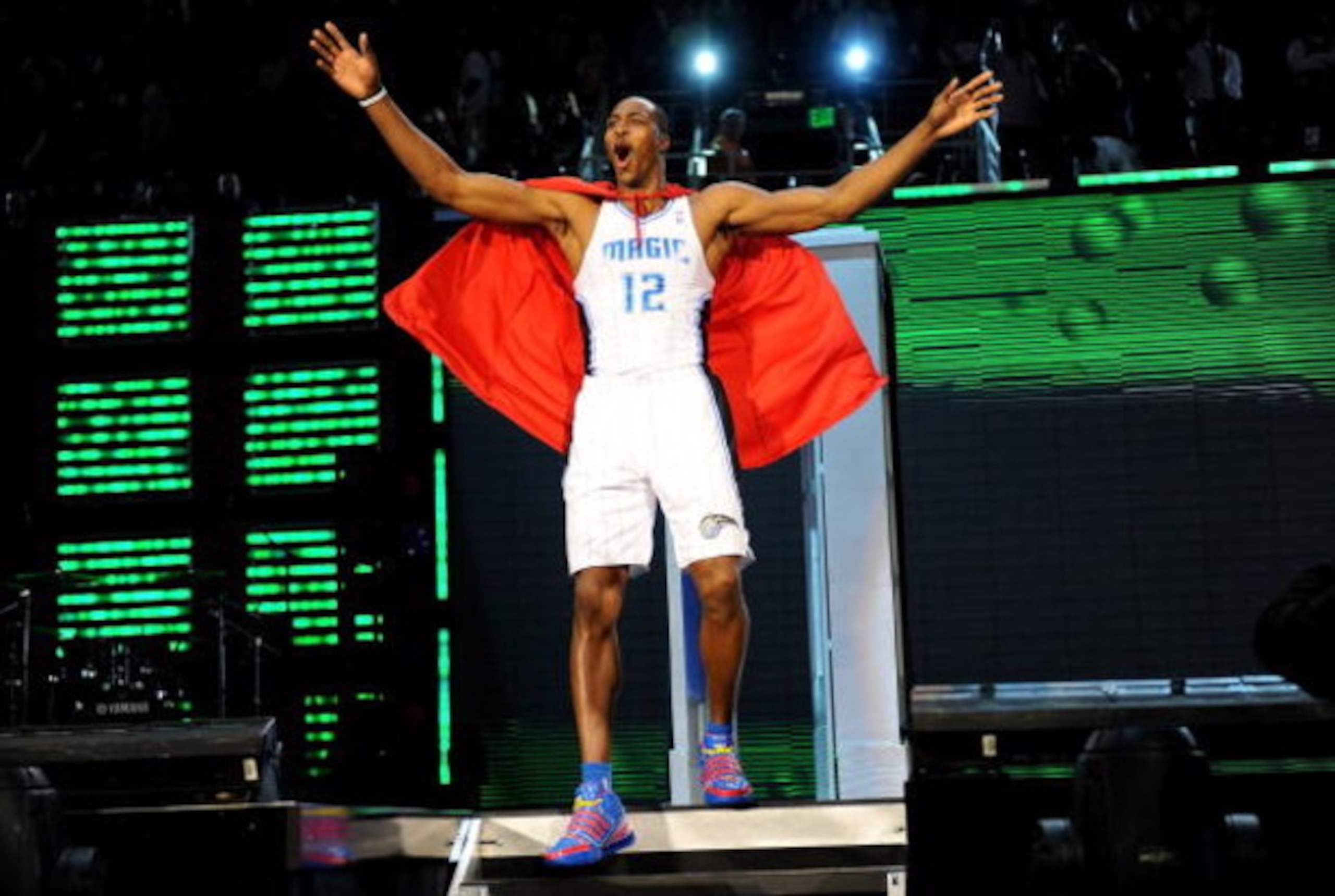 PHOENIX - FEBRUARY 14: Dwight Howard of the Orlando Magic emerges from a phone booth wearing a Superman cape during the Sprite Slam Dunk Contest on All-Star Saturday Night, part of 2009 NBA All-Star Weekend at US Airways Center on February 14, 2009 in Ph PHOENIX - FEBRUARY 14: Dwight Howard of the Orlando Magic emerges from a phone booth wearing a Superman cape during the Sprite Slam Dunk Contest on All-Star Saturday Night, part of 2009 NBA All-Star Weekend at US Airways Center on February 14, 2009 in Ph
