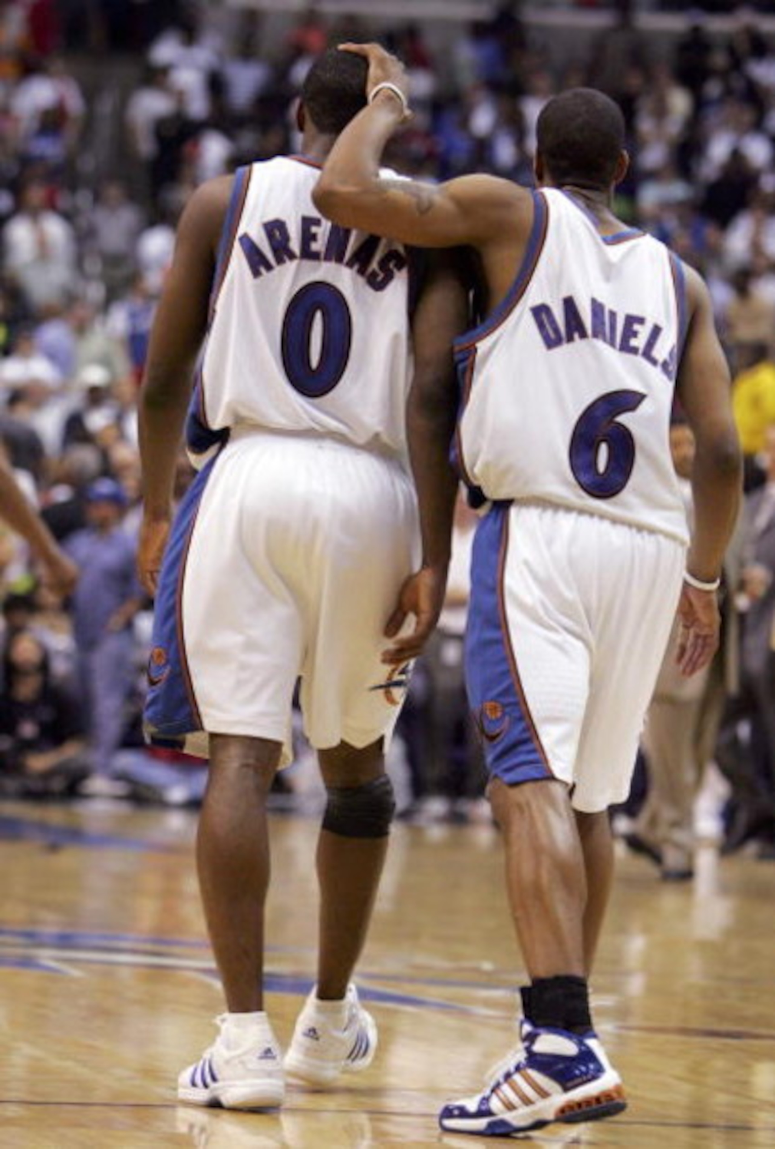WASHINGTON - MAY 05: Antonio Daniels #6 of the Washington Wizards consoles teammate Gilbert Arenas #0 after Arenas missed 2 free throws with 15 seconds left in overtime of game six of the Eastern Conference Quarterfinals against the Cleveland Cavaliers d WASHINGTON - MAY 05: Antonio Daniels #6 of the Washington Wizards consoles teammate Gilbert Arenas #0 after Arenas missed 2 free throws with 15 seconds left in overtime of game six of the Eastern Conference Quarterfinals against the Cleveland Cavaliers d