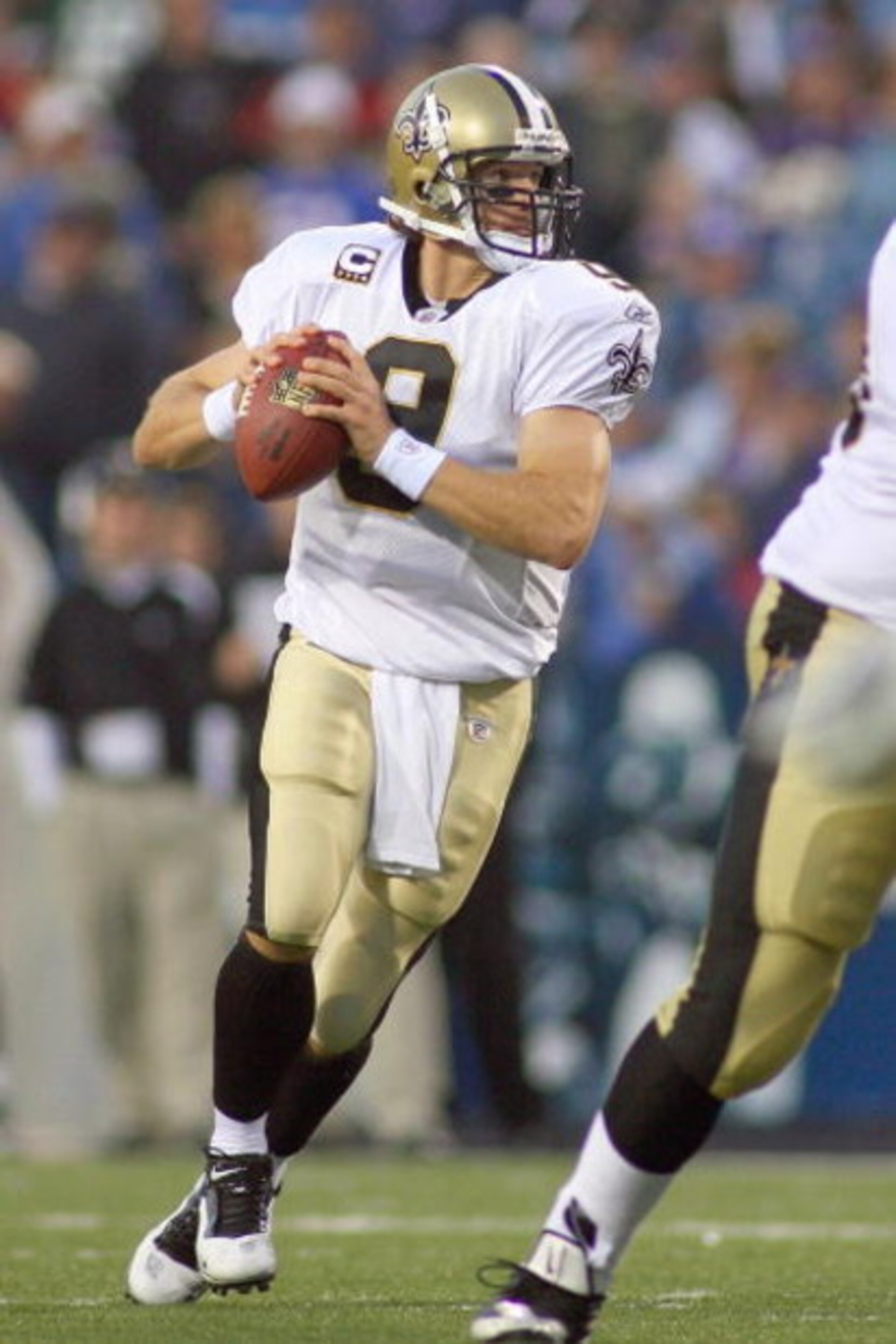 ORCHARD PARK, NY - SEPTEMBER 27:  Quarterback Drew Brees #9 of the New Orleans Saints moves to pass the ball during the game against the Buffalo Bills at Ralph Wilson Stadium on September 27, 2009 in Orchard Park, New York. The Saints won 27-7. (Photo by 