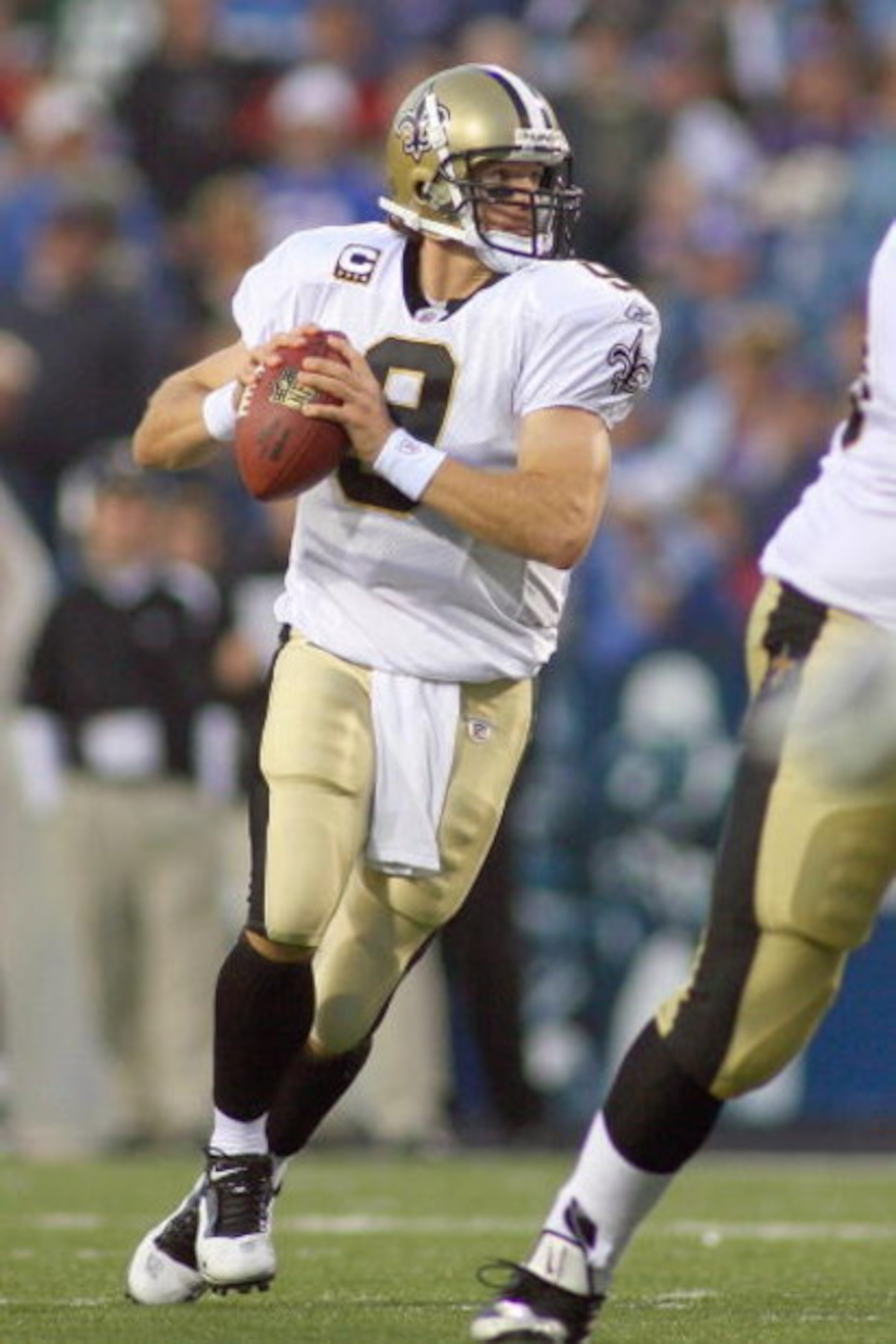ORCHARD PARK, NY - SEPTEMBER 27:  Quarterback Drew Brees #9 of the New Orleans Saints moves to pass the ball during the game against the Buffalo Bills at Ralph Wilson Stadium on September 27, 2009 in Orchard Park, New York. The Saints won 27-7. (Photo by 