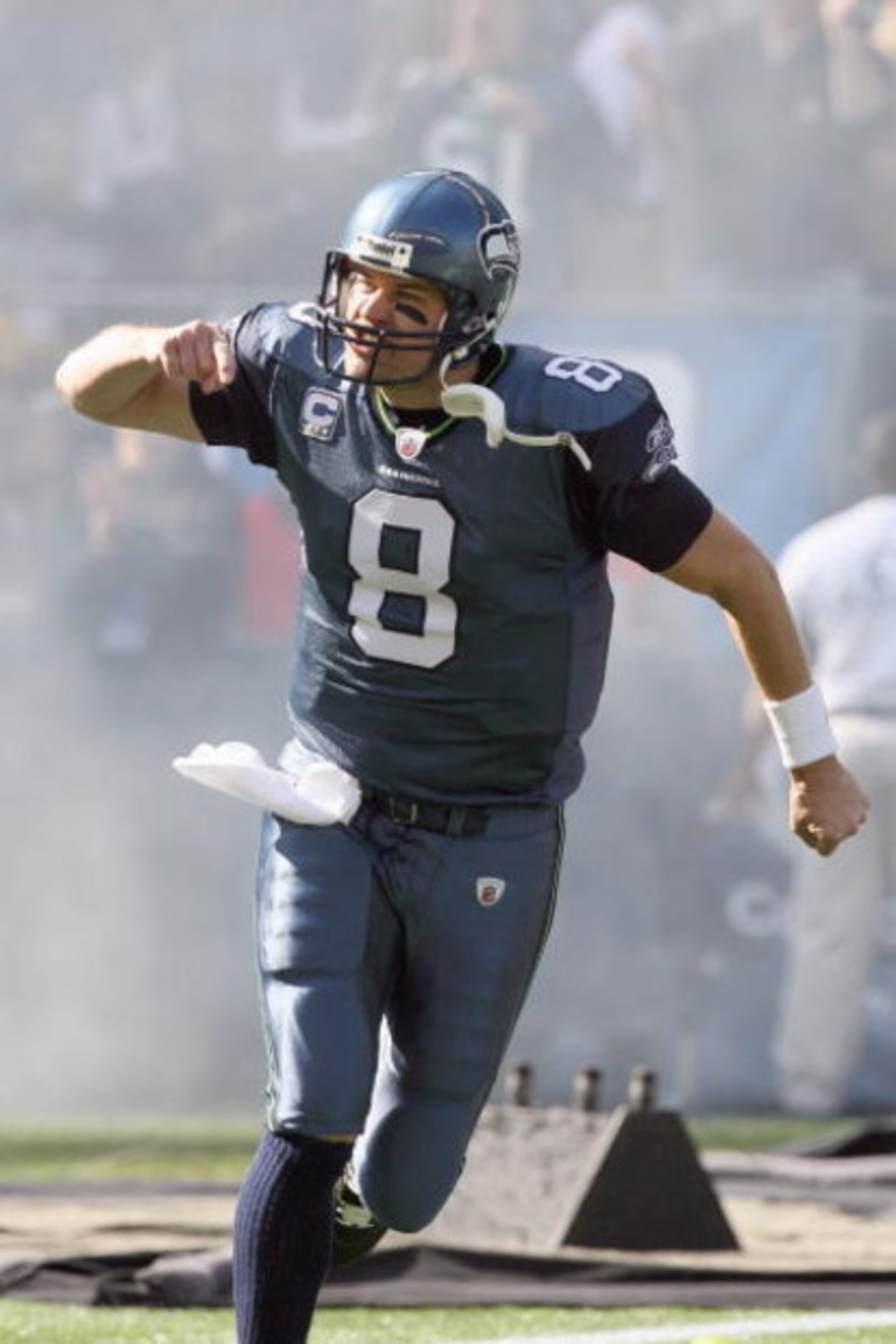 SEATTLE - OCTOBER 11: Quarterback Matt Hasselbeck #8 of the Seattle Seahawks celebrates as he runs onto the field before the game against the Jacksonville Jaguars on October 11, 2009 at Qwest Field in Seattle, Washington. The Seahawks defeated the Jaguars