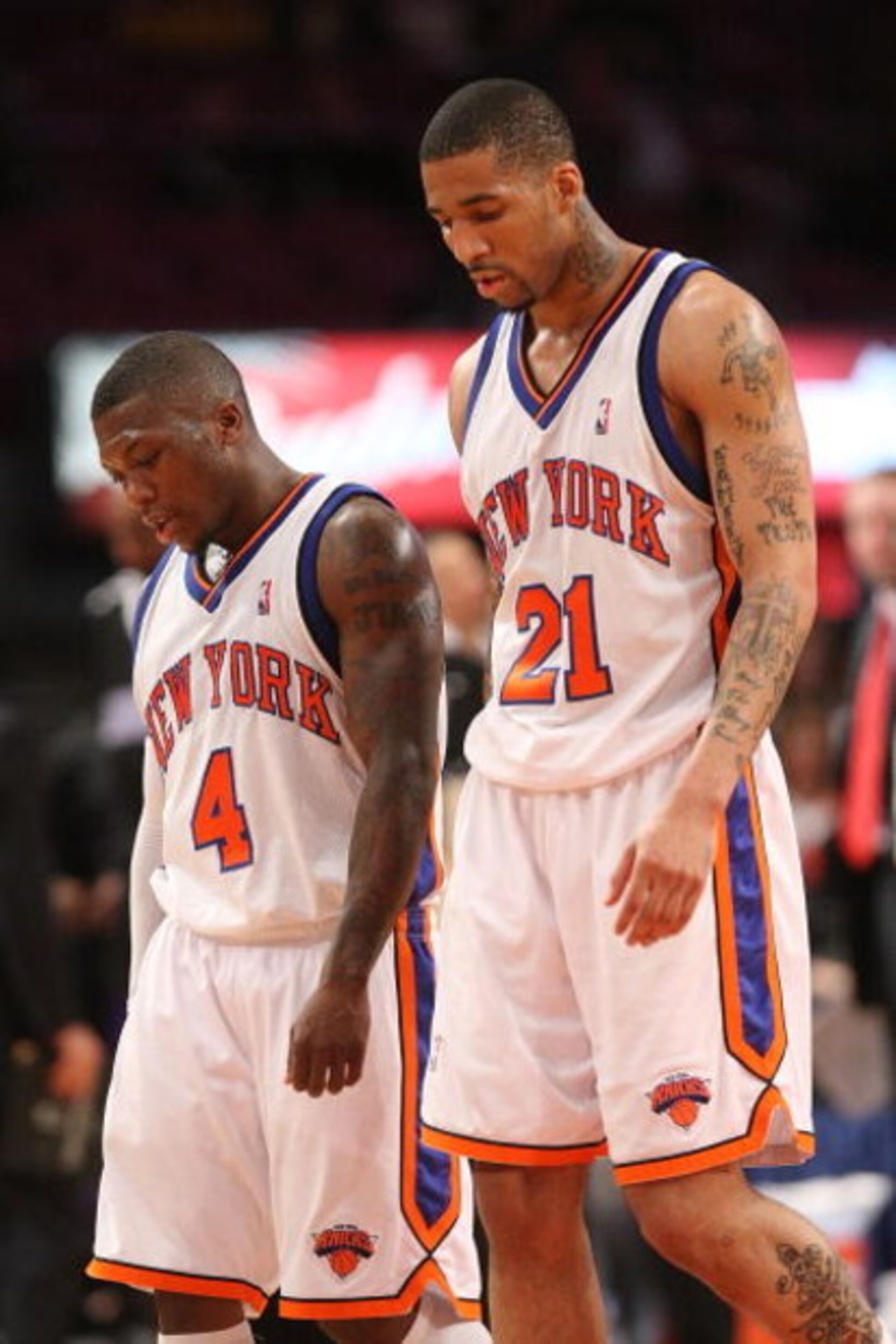 NEW YORK - MARCH 20:  Nate Robinson #4 of the New York Knicks walks from the court with teammate Wilson Chandler #21 against the Sacramento Kingson March 20, 2009 at Madison Square Garden in New York City. NOTE TO USER: User expressly acknowledges and agr