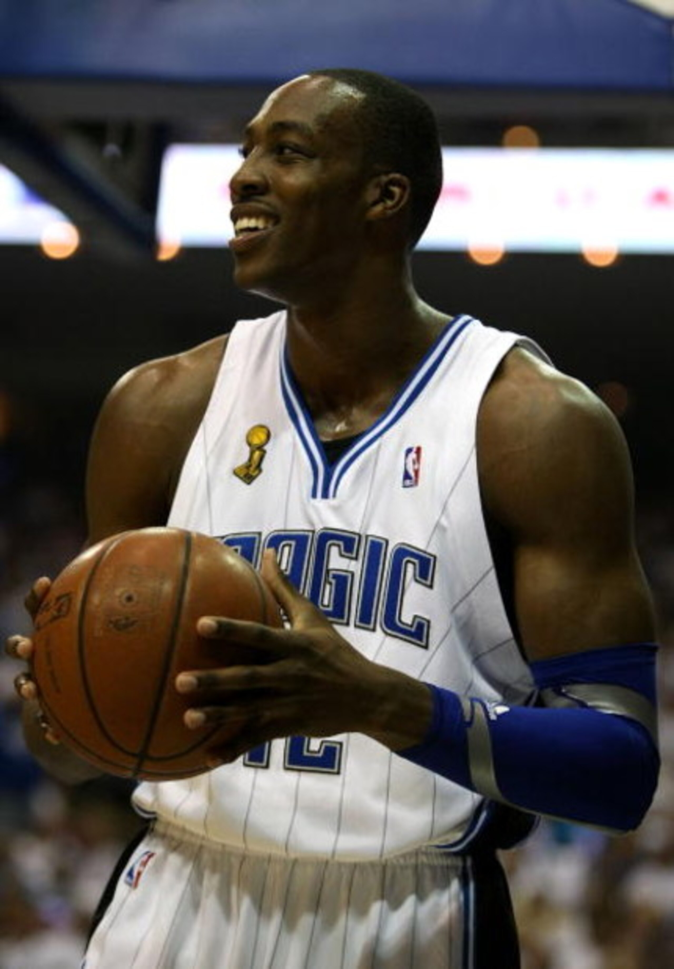 ORLANDO, FL - JUNE 14:  Dwight Howard #12 of the Orlando Magic smiles in the first half against the Los Angeles Lakers in Game Five of the 2009 NBA Finals on June 14, 2009 at Amway Arena in Orlando, Florida.  NOTE TO USER:  User expressly acknowledges and