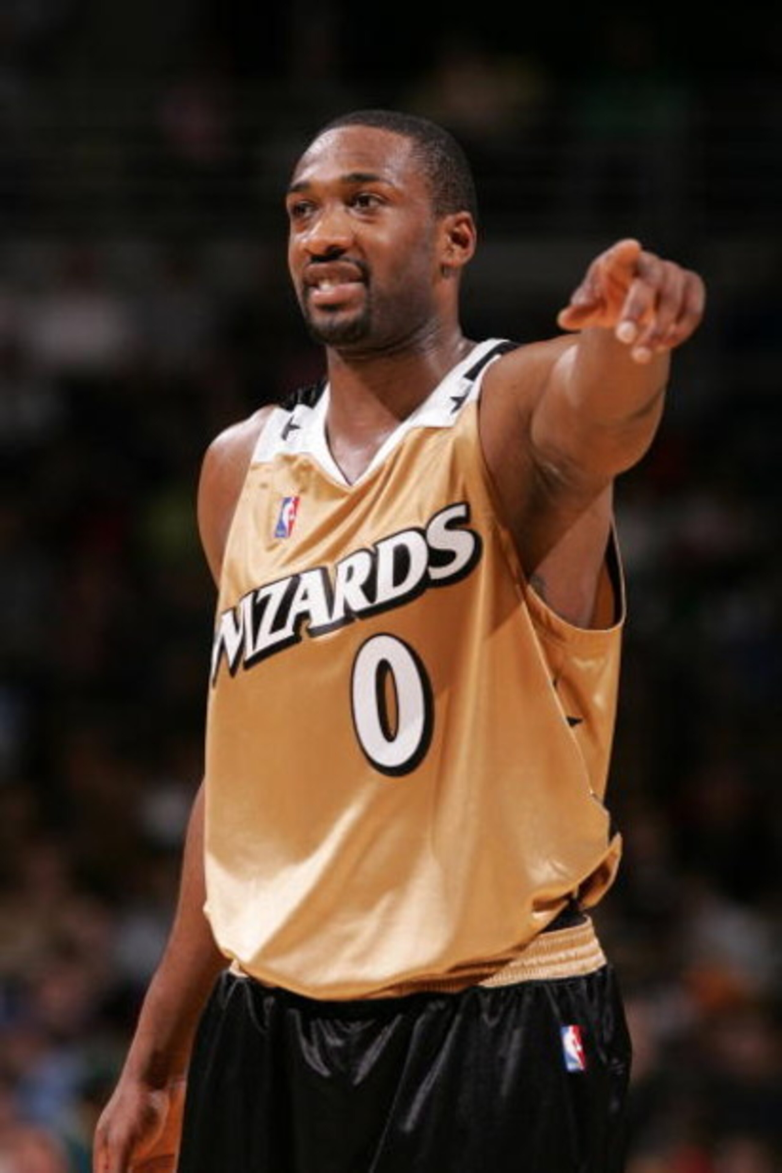 MILWAUKEE - APRIL 1:  Gilbert Arenas #0 of the Washington Wizards points during the game against the Milwaukee Bucks on April 1, 2007 at the Bradley Center in Milwaukee, Wisconsin. The Wizards won 121-107. NOTE TO USER: User expressly acknowledges and agr