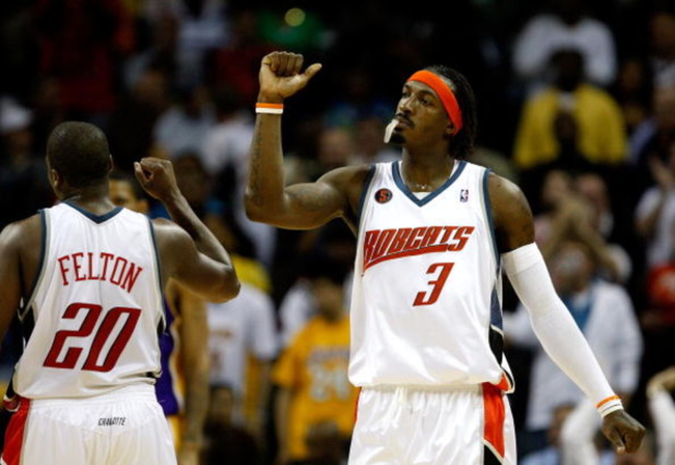 CHARLOTTE, NC - MARCH 31:  Gerald Wallace #3 and Raymond Felton #20 of the Charlotte Bobcats react after a play during their game against the Los Angeles Lakers at Time Warner Cable Arena on March 31, 2009 in Charlotte, North Carolina.  NOTE TO USER: User