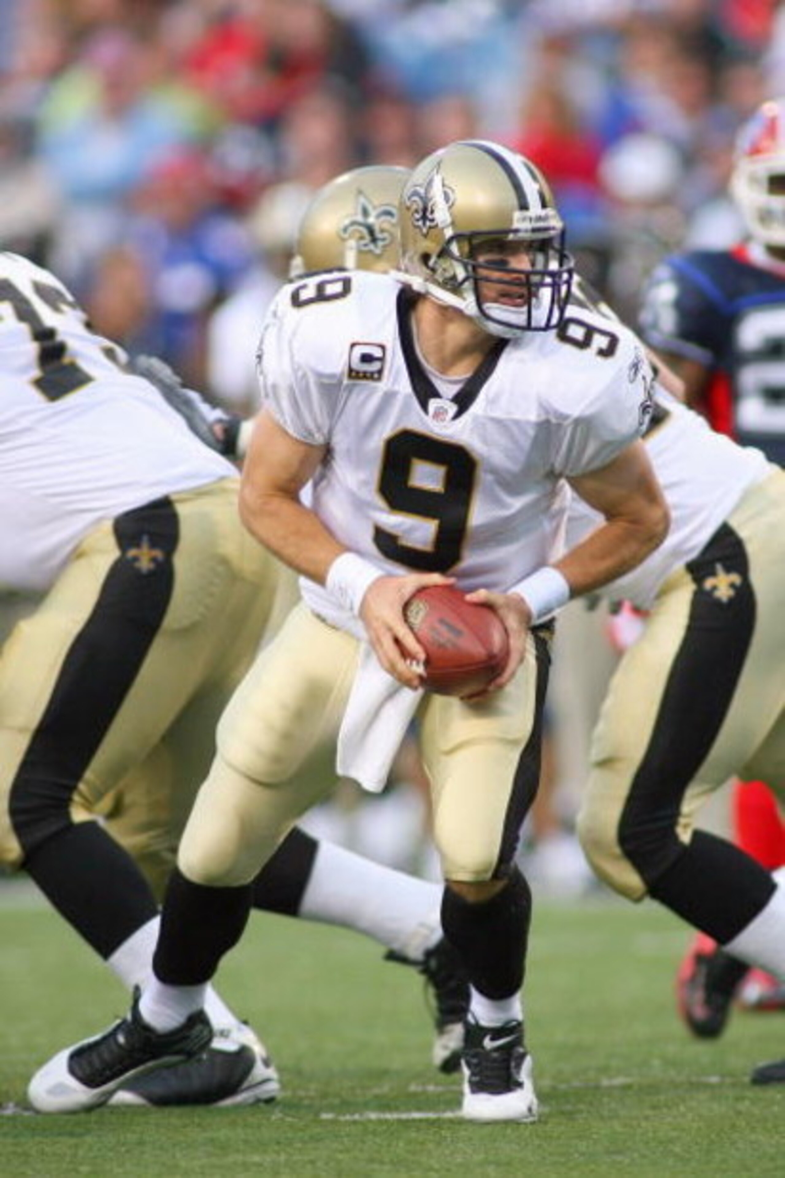 ORCHARD PARK, NY - SEPTEMBER 27: Quarterback Drew Brees #9 of the New Orleans Saints looks to hand off the ball during the game against the Buffalo Bills at Ralph Wilson Stadium on September 27, 2009 in Orchard Park, New York. The Saints won 27-7. (Photo ORCHARD PARK, NY - SEPTEMBER 27: Quarterback Drew Brees #9 of the New Orleans Saints looks to hand off the ball during the game against the Buffalo Bills at Ralph Wilson Stadium on September 27, 2009 in Orchard Park, New York. The Saints won 27-7. (Photo