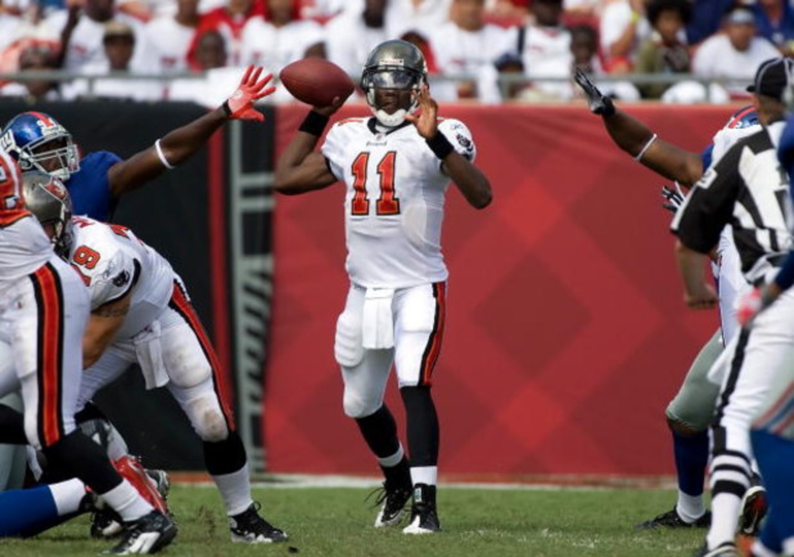 TAMPA, FL - SEPTEMBER 27: Quarterback Josh Johnson #11 of the Tampa Bay Buccaneers looks for an open receiver against the New York Giants during the game at Raymond James Stadium on September 27, 2009 in Tampa, Florida. (Photo by J. Meric/Getty Images) TAMPA, FL - SEPTEMBER 27: Quarterback Josh Johnson #11 of the Tampa Bay Buccaneers looks for an open receiver against the New York Giants during the game at Raymond James Stadium on September 27, 2009 in Tampa, Florida. (Photo by J. Meric/Getty Images)