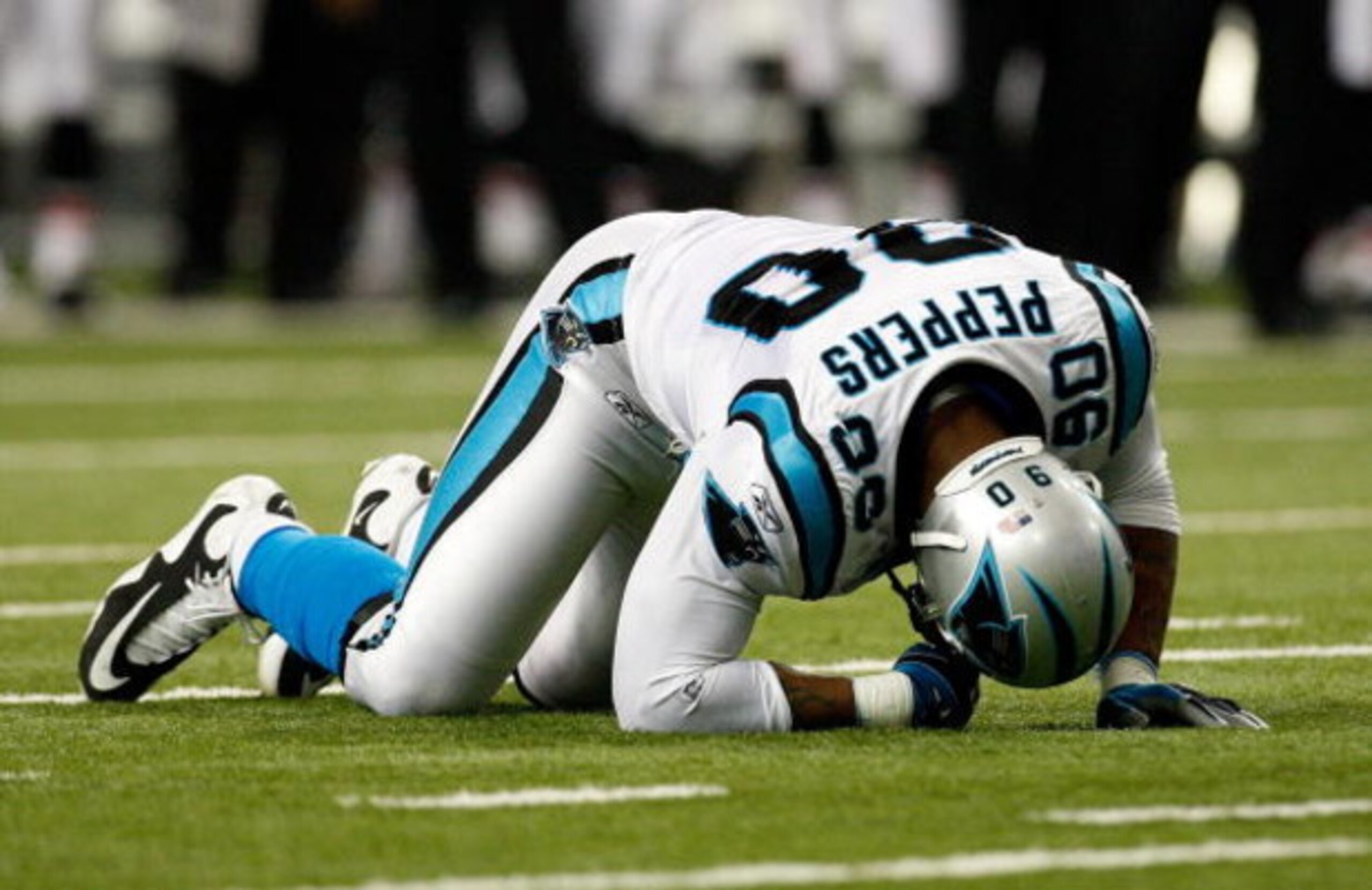 ATLANTA - SEPTEMBER 20: Julius Peppers #90 of the Carolina Panthers is slow to get up against the Atlanta Falcons at Georgia Dome on September 20, 2009 in Atlanta, Georgia. (Photo by Kevin C. Cox/Getty Images) ATLANTA - SEPTEMBER 20: Julius Peppers #90 of the Carolina Panthers is slow to get up against the Atlanta Falcons at Georgia Dome on September 20, 2009 in Atlanta, Georgia. (Photo by Kevin C. Cox/Getty Images)