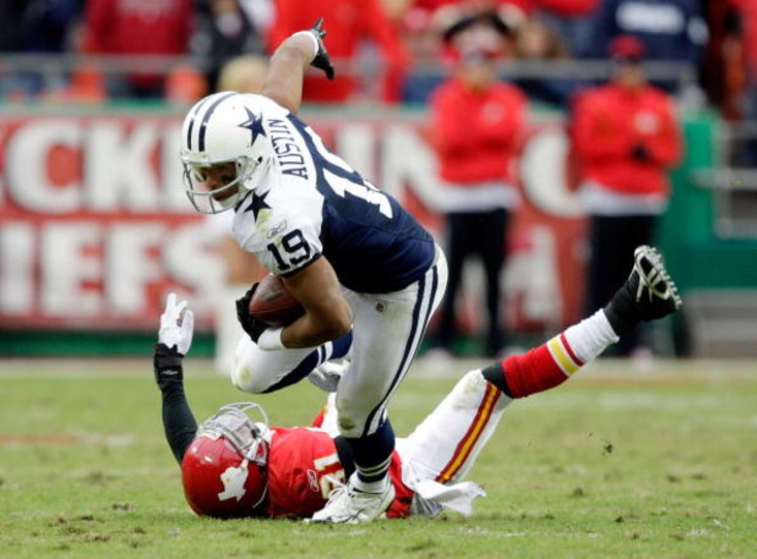 KANSAS CITY, MO - OCTOBER 11: Miles Austin #19 of the Dallas Cowboys breaks a tackle and continues to the endzone for a touchdown to win the game in overtime during the game against the Kansas City Chiefs on October 11, 2009 at Arrowhead Stadiumin Kansas KANSAS CITY, MO - OCTOBER 11: Miles Austin #19 of the Dallas Cowboys breaks a tackle and continues to the endzone for a touchdown to win the game in overtime during the game against the Kansas City Chiefs on October 11, 2009 at Arrowhead Stadiumin Kansas
