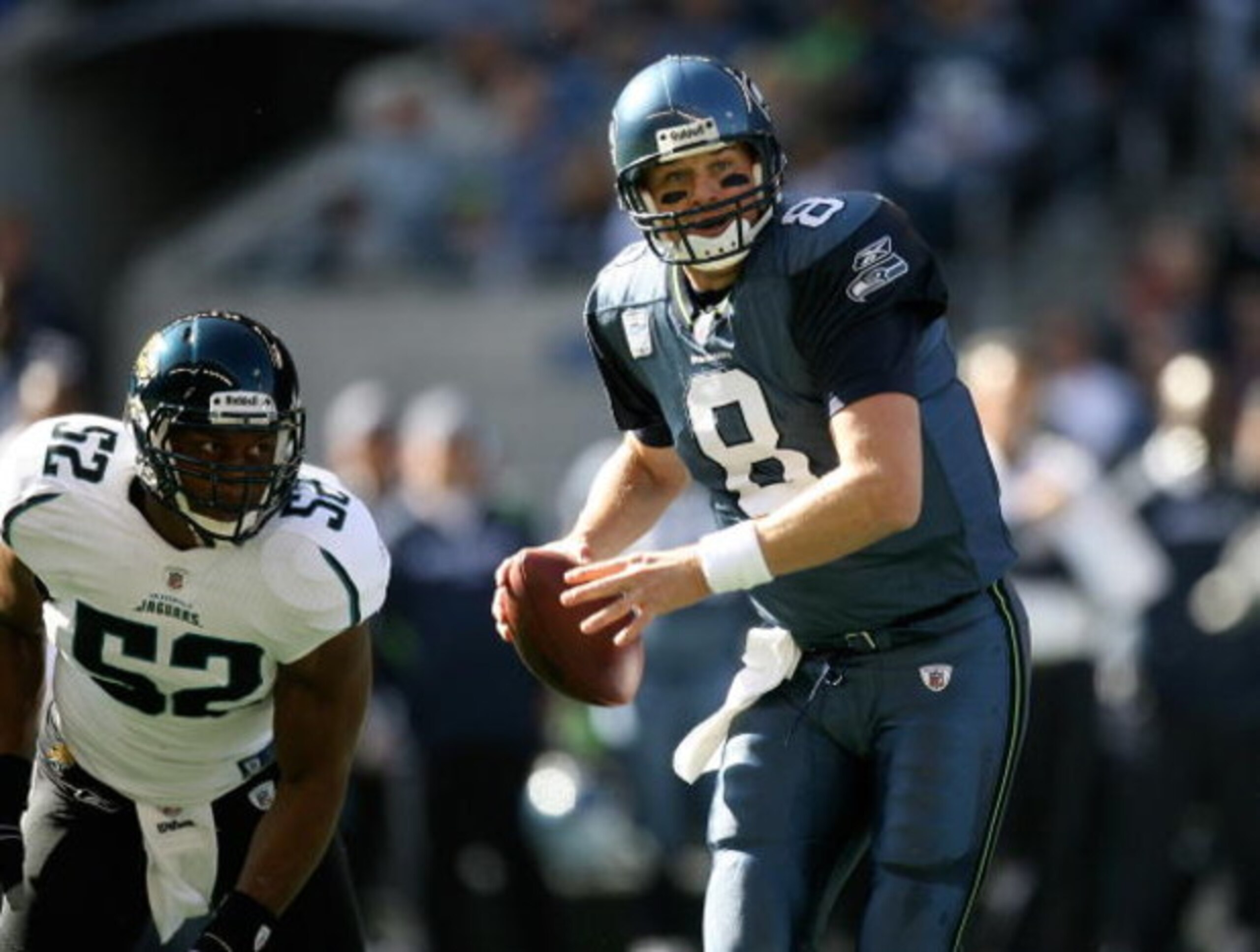 SEATTLE - OCTOBER 11: Quarterback Matt Hasselbeck #8 of the Seattle Seahawks scrambles against linebacker Daryl Smith #52 of the Jacksonville Jaguars on October 11, 2009 at Qwest Field in Seattle, Washington. The Seahawks defeated the Jaguars 41-0. (Phot SEATTLE - OCTOBER 11: Quarterback Matt Hasselbeck #8 of the Seattle Seahawks scrambles against linebacker Daryl Smith #52 of the Jacksonville Jaguars on October 11, 2009 at Qwest Field in Seattle, Washington. The Seahawks defeated the Jaguars 41-0. (Phot