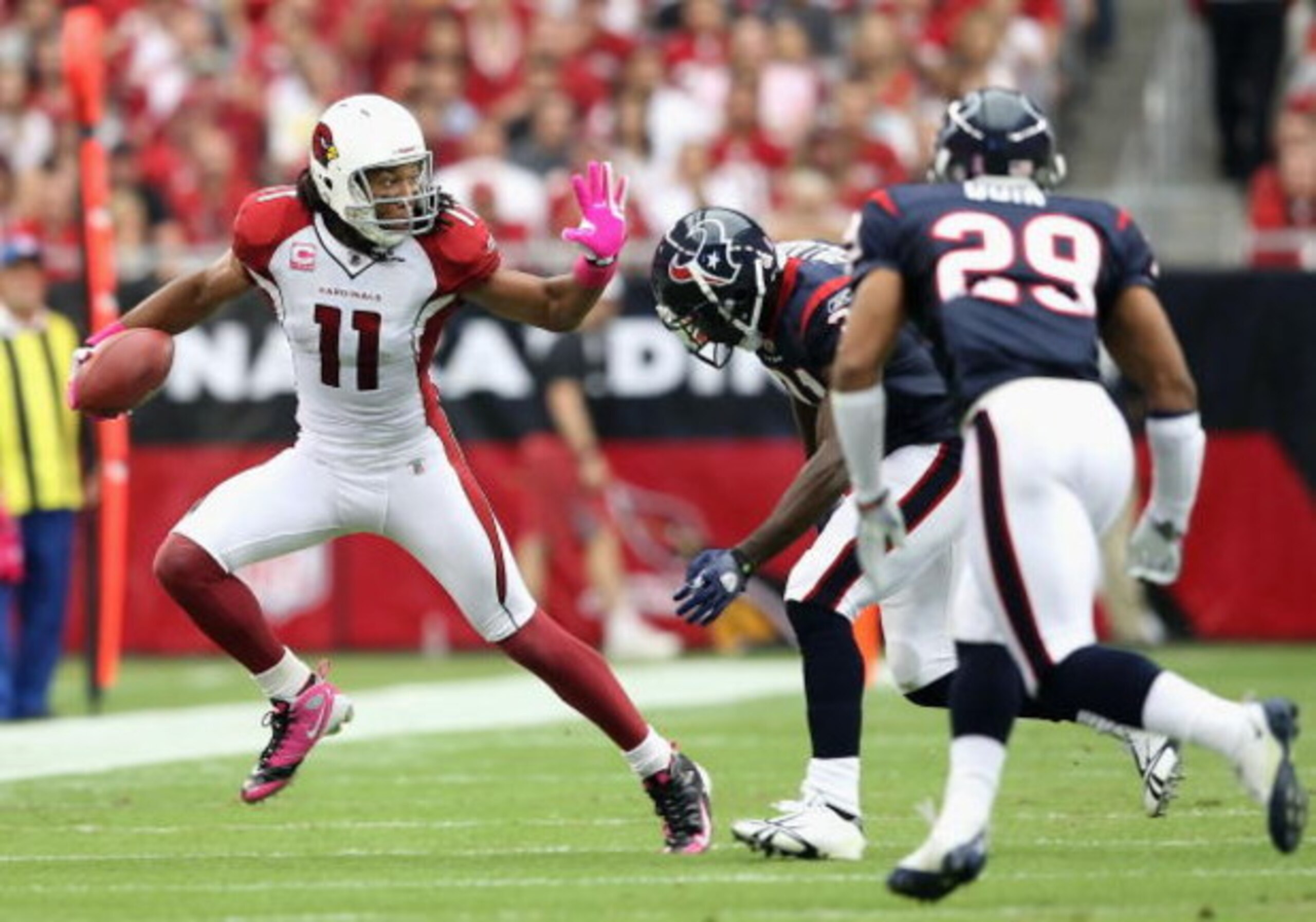 GLENDALE, AZ - OCTOBER 11: Wide receiver Larry Fitzgerald #11 of the Arizona Cardinals runs with the ball after a reception past Bernard Pollard #31 of the Houston Texans during the NFL game at the Universtity of Phoenix Stadium on October 11, 2009 in Gl GLENDALE, AZ - OCTOBER 11: Wide receiver Larry Fitzgerald #11 of the Arizona Cardinals runs with the ball after a reception past Bernard Pollard #31 of the Houston Texans during the NFL game at the Universtity of Phoenix Stadium on October 11, 2009 in Gl