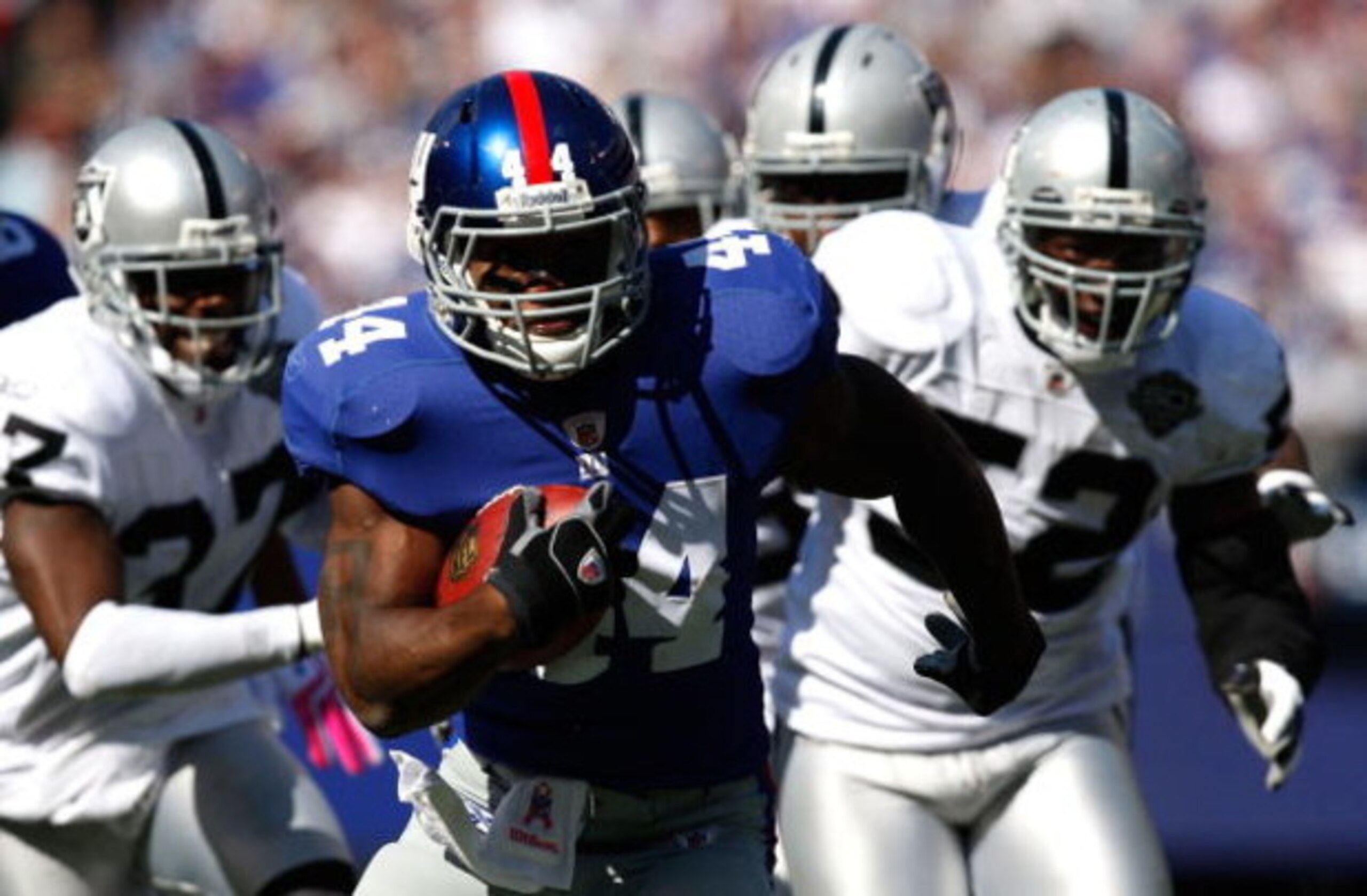 EAST RUTHERFORD, NJ - OCTOBER 11: Ahmad Bradshaw #44 of the New York Giants runs past the Oakland Raiders defense in the first quarter during the game on October 11, 2009 at Giants Stadium in East Rutherford, New Jersey. (Photo by Jared Wickerham/Getty EAST RUTHERFORD, NJ - OCTOBER 11: Ahmad Bradshaw #44 of the New York Giants runs past the Oakland Raiders defense in the first quarter during the game on October 11, 2009 at Giants Stadium in East Rutherford, New Jersey. (Photo by Jared Wickerham/Getty
