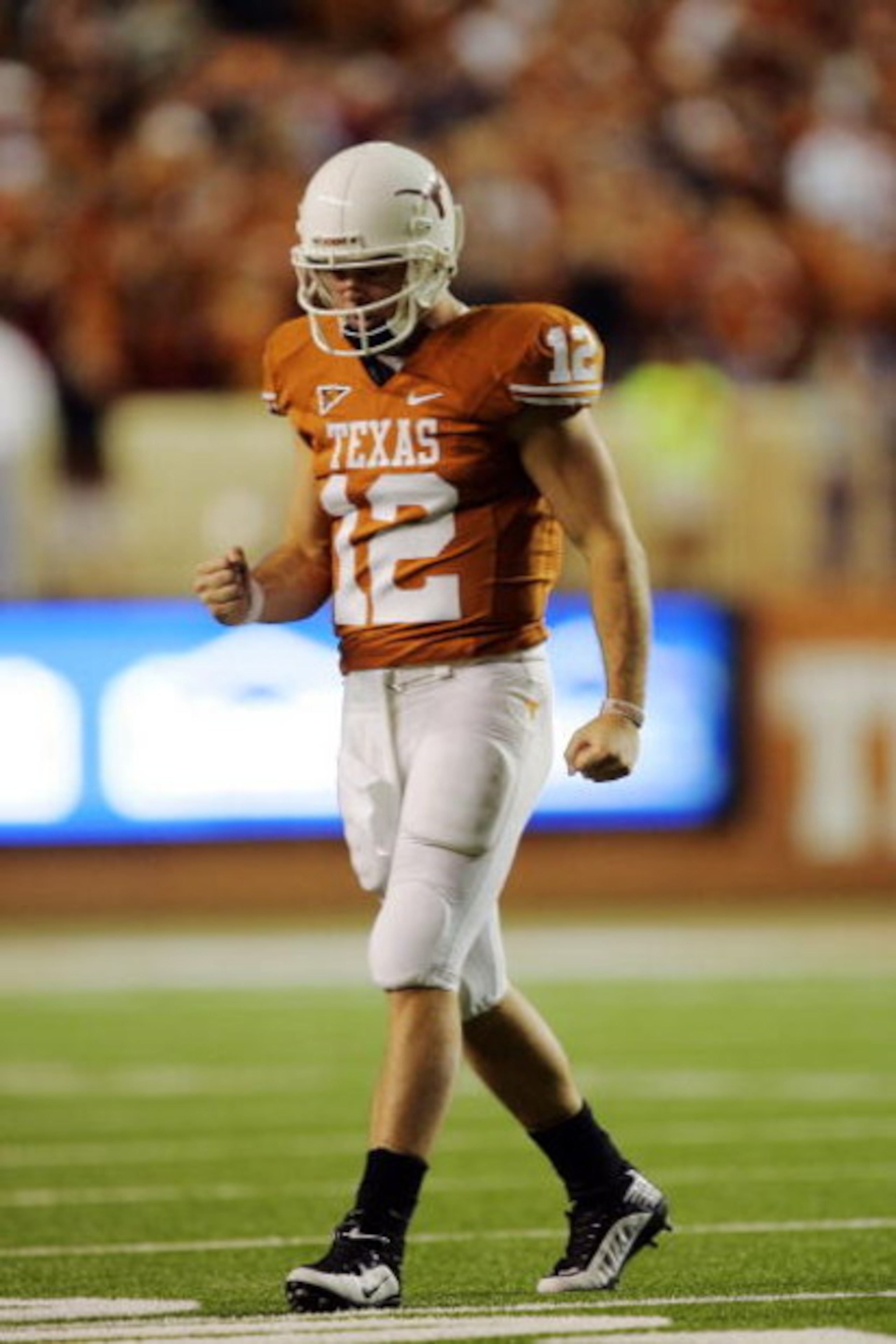 AUSTIN, TX - OCTOBER 10:  Quarterback Colt McCoy #12 of the Texas Longhorns pumps his fists after throwing a touchdown pass against the Colorado Buffaloes in the final minute of the second quarter on October 10, 2009 at Darrell K Royal-Texas Memorial Stad