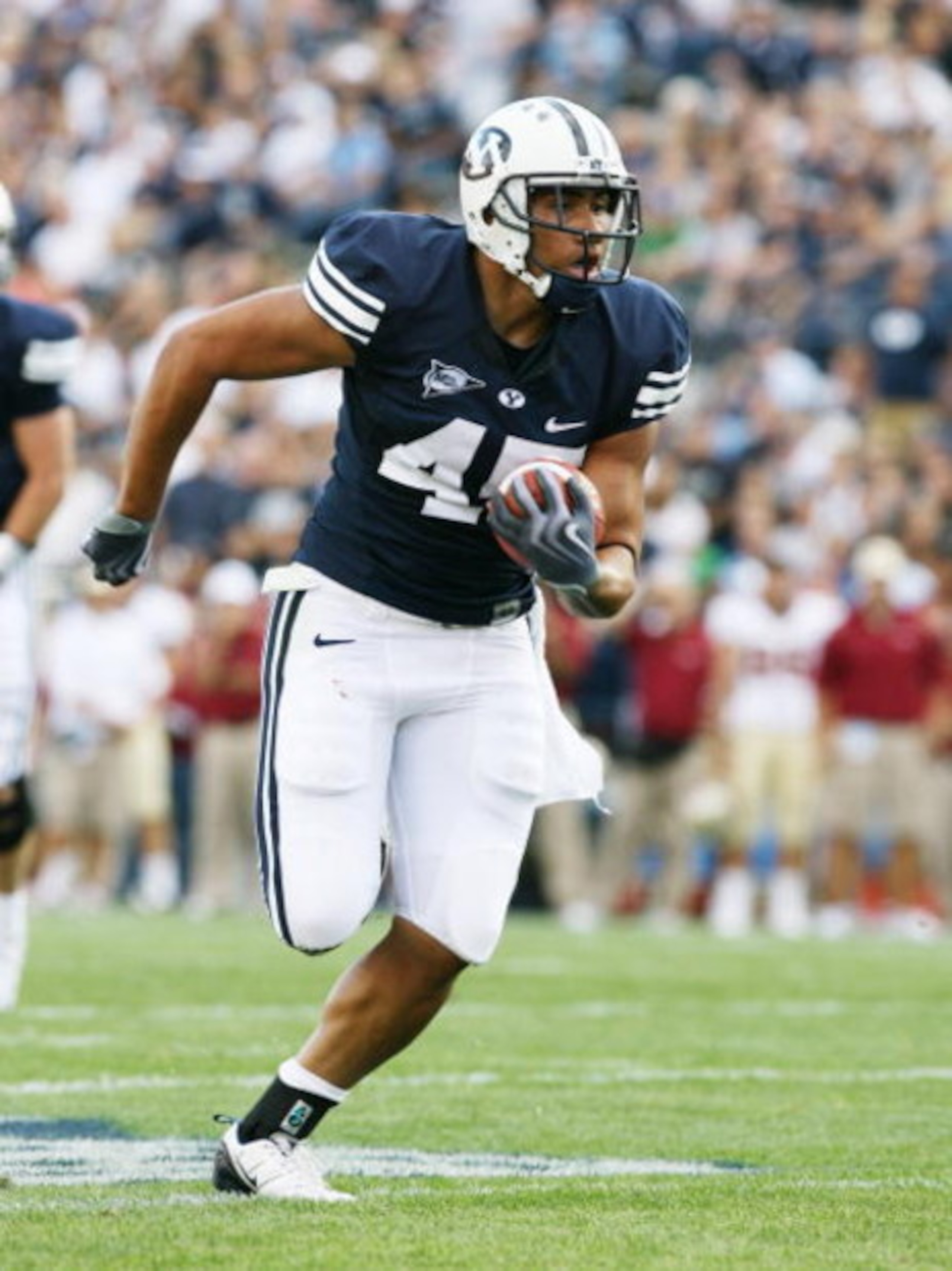 PROVO, UT. - SEPTEMBER 19:  Harvey Unga #45 of the Brigham Young Cougars runs against the Florida State Seminoles at La Vell Edwards Stadium on September 19, 2009 in Provo, Utah.  (Photo by Melissa Majchrzak/Getty Images)