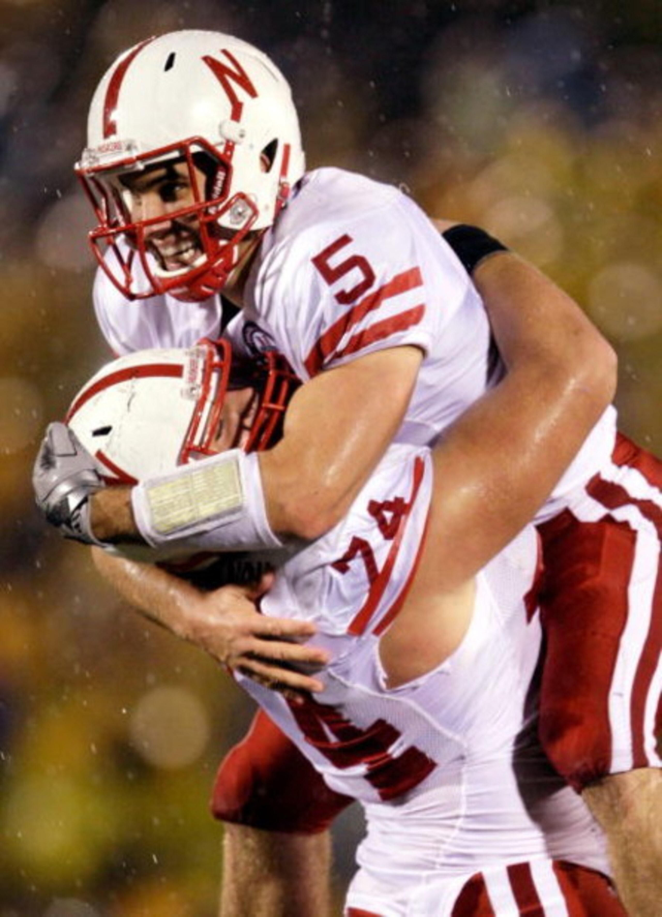 COLUMBIA, MO - OCTOBER 08: Quarterback Zac Lee #5 of the Nebraska Cornhuskers jumps into the arms of Ricky Henry #74 after scoring a touchdown during the game against the Missouri Tigers on October 8, 2009 at Faurot Field/Memorial Stadium in Columbia, Mi COLUMBIA, MO - OCTOBER 08: Quarterback Zac Lee #5 of the Nebraska Cornhuskers jumps into the arms of Ricky Henry #74 after scoring a touchdown during the game against the Missouri Tigers on October 8, 2009 at Faurot Field/Memorial Stadium in Columbia, Mi