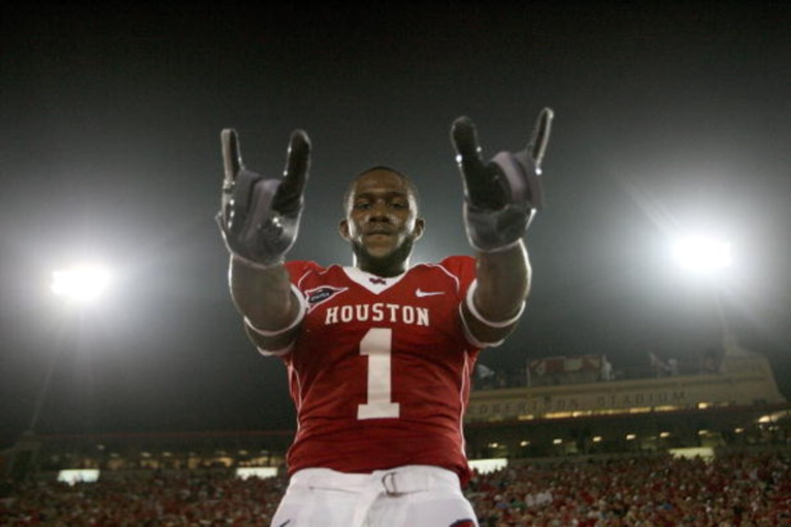 HOUSTON - SEPTEMBER 26: A.J. Dugat of the Houston Cougars celebrates the UH win against Texas Tech Red Raiders at Robertson Stadium on September 26, 2009 in Houston, Texas. (Photo by Thomas B. Shea/Getty Images) HOUSTON - SEPTEMBER 26: A.J. Dugat of the Houston Cougars celebrates the UH win against Texas Tech Red Raiders at Robertson Stadium on September 26, 2009 in Houston, Texas. (Photo by Thomas B. Shea/Getty Images)