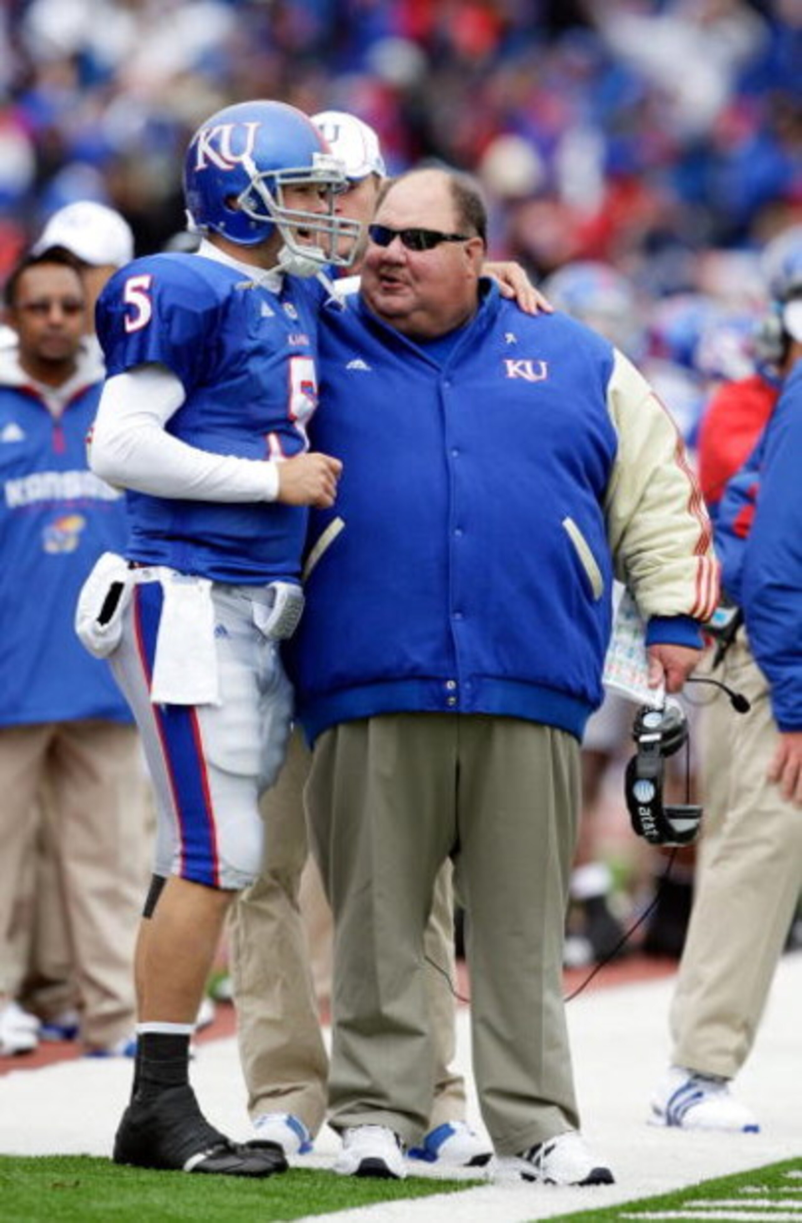 LAWRENCE, KS - OCTOBER 10: Quarterback Todd Reesing #5 of the Kansas Jayhawks puts his arm around head coach Mark Mangino after rushing for a touchdown during the game against the Iowa State Cyclones on October 10, 2009 at Memorial Stadium in Lawrence, K LAWRENCE, KS - OCTOBER 10: Quarterback Todd Reesing #5 of the Kansas Jayhawks puts his arm around head coach Mark Mangino after rushing for a touchdown during the game against the Iowa State Cyclones on October 10, 2009 at Memorial Stadium in Lawrence, K