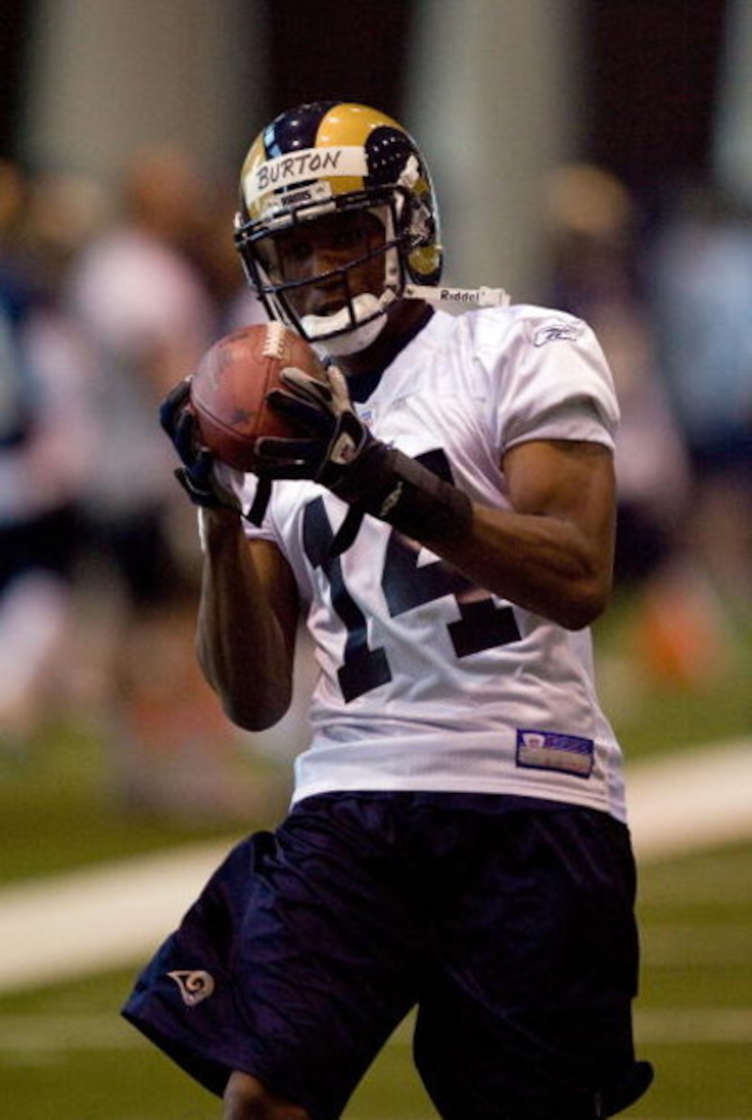 EARTH CITY, MO - MAY 9: Keenan Burton #14 of the St. Louis Rams hauls in a pass during a mini camp on May 9, 2008 at Russell Athletic Training Facility in Earth City, Missouri. (Photo by Dilip Vishwanat/Getty Images)