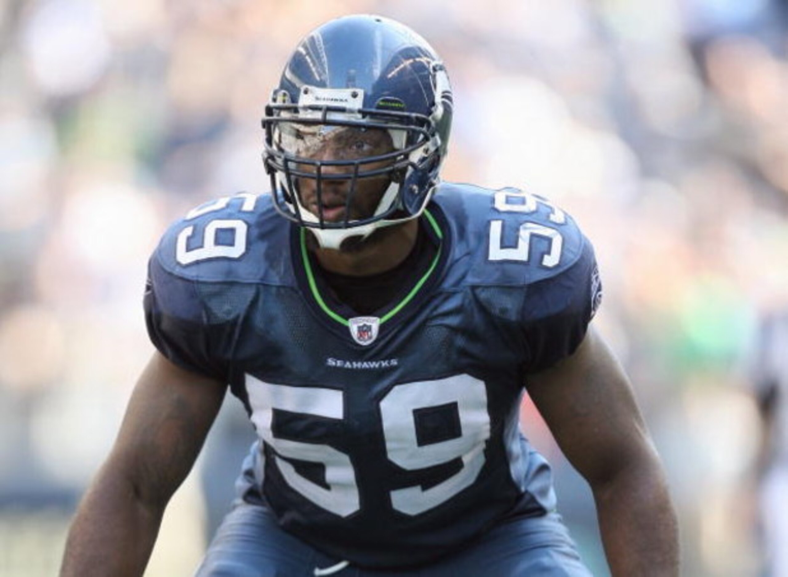 SEATTLE , WA - SEPTEMBER 13:  Aaron Curry #59 of the Seattle Seahawks gets ready on the line during the game against the St. Louis Rams at Qwest Field on September 13, 2009 in Seattle, Washington. (Photo by Otto Greule Jr/Getty Images)
