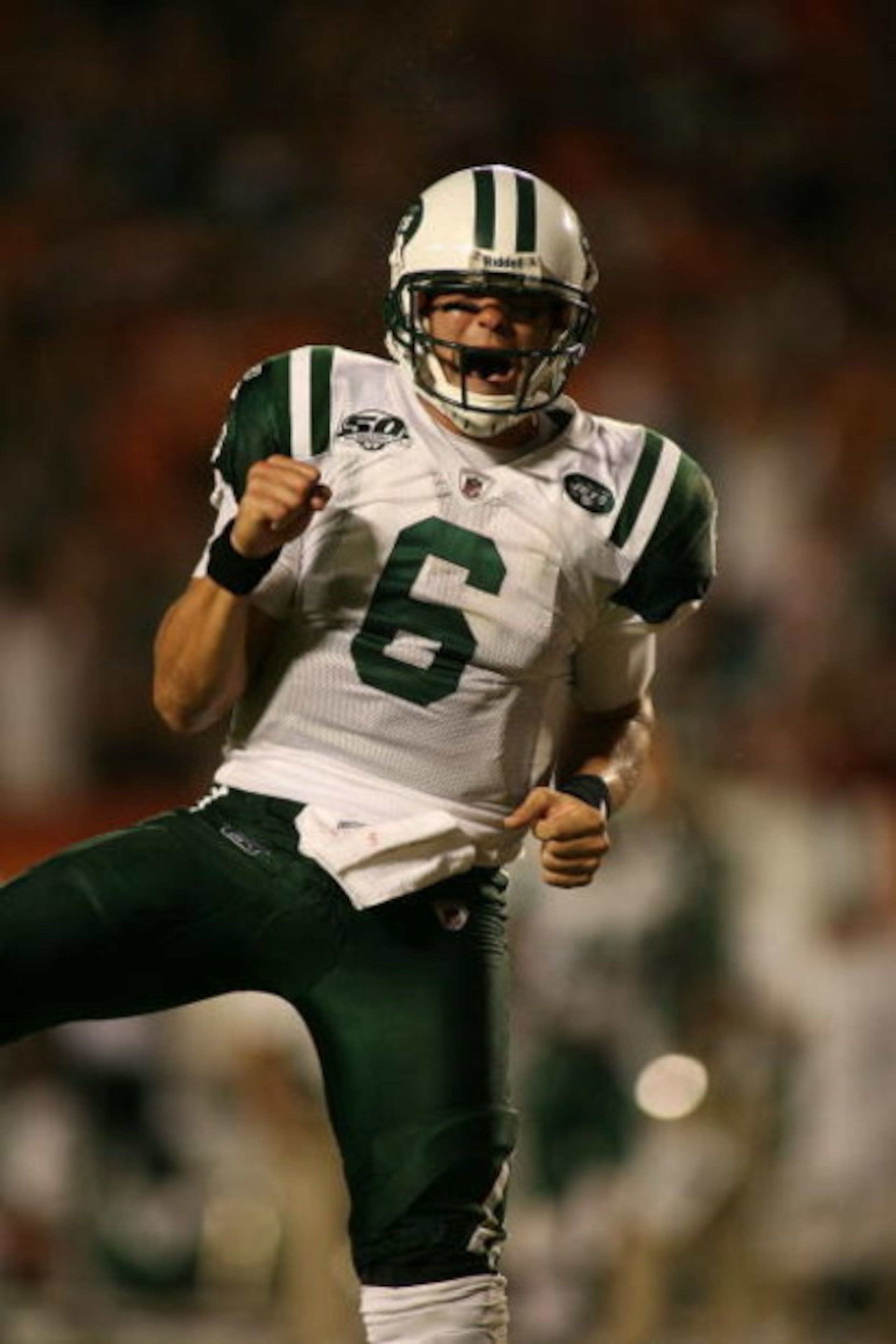 MIAMI - OCTOBER 12:  Quarterback Mark Sanchez #6 of the New York Jets celebrate a touchdown against the Miami Dolphins at Land Shark Stadium on October 12, 2009 in Miami, Florida. Miami defeated New York 31-27.  (Photo by Marc Serota/Getty Images)