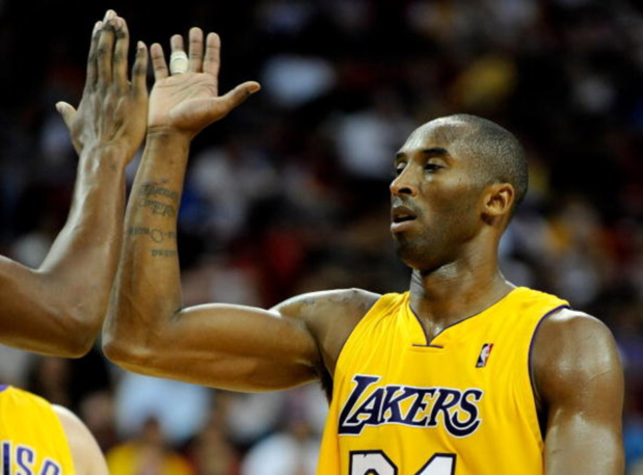 LAS VEGAS - OCTOBER 15: Kobe Bryant #24 of the Los Angeles Lakers high-fives Andrew Bynum #17 during their preseason game against the Sacramento Kings at the Thomas & Mack Center October 15, 2009 in Las Vegas, Nevada. NOTE TO USER: User expressly acknow LAS VEGAS - OCTOBER 15: Kobe Bryant #24 of the Los Angeles Lakers high-fives Andrew Bynum #17 during their preseason game against the Sacramento Kings at the Thomas & Mack Center October 15, 2009 in Las Vegas, Nevada. NOTE TO USER: User expressly acknow