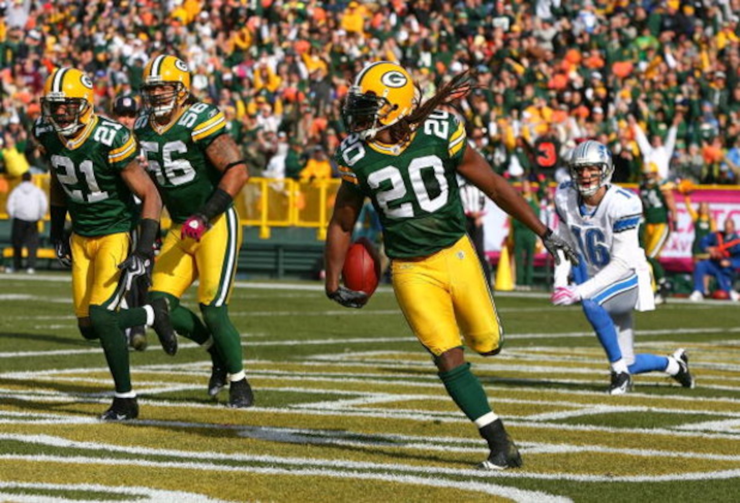 GREEN BAY, WI - OCTOBER 18: Atari Bigby #20 of the Green Bay Packers celebrates an interception in the end zone on a pass intended for John Standeford #16 of the Detroit Lions as teammates Charles Woodson #21 and Nick Barnett#56 run off the field at Lambe GREEN BAY, WI - OCTOBER 18: Atari Bigby #20 of the Green Bay Packers celebrates an interception in the end zone on a pass intended for John Standeford #16 of the Detroit Lions as teammates Charles Woodson #21 and Nick Barnett#56 run off the field at Lambe