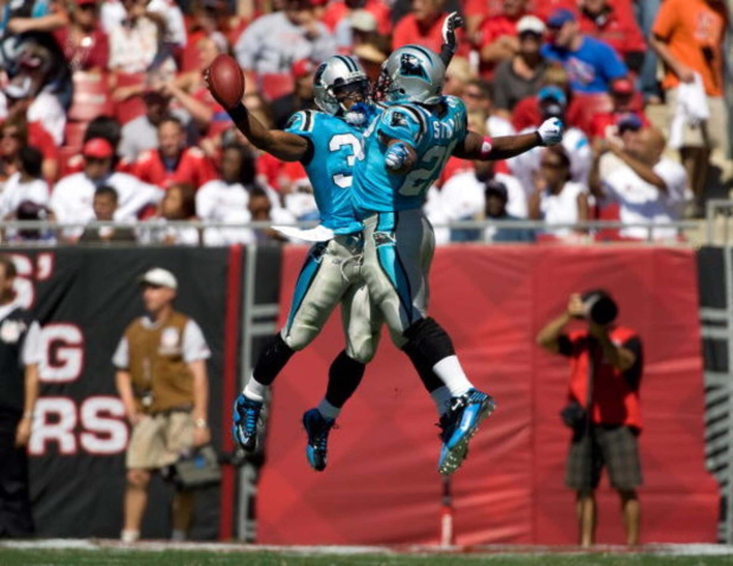 TAMPA, FL - OCTOBER 18: Safety Charles Godfrey #30 and running back Jonathan Stewart #28 of the Carolina Panthers celebrate a turnover against the Tampa Bay Buccaneers during the game at Raymond James Stadium on October 18, 2009 in Tampa, Florida. (Phot TAMPA, FL - OCTOBER 18: Safety Charles Godfrey #30 and running back Jonathan Stewart #28 of the Carolina Panthers celebrate a turnover against the Tampa Bay Buccaneers during the game at Raymond James Stadium on October 18, 2009 in Tampa, Florida. (Phot
