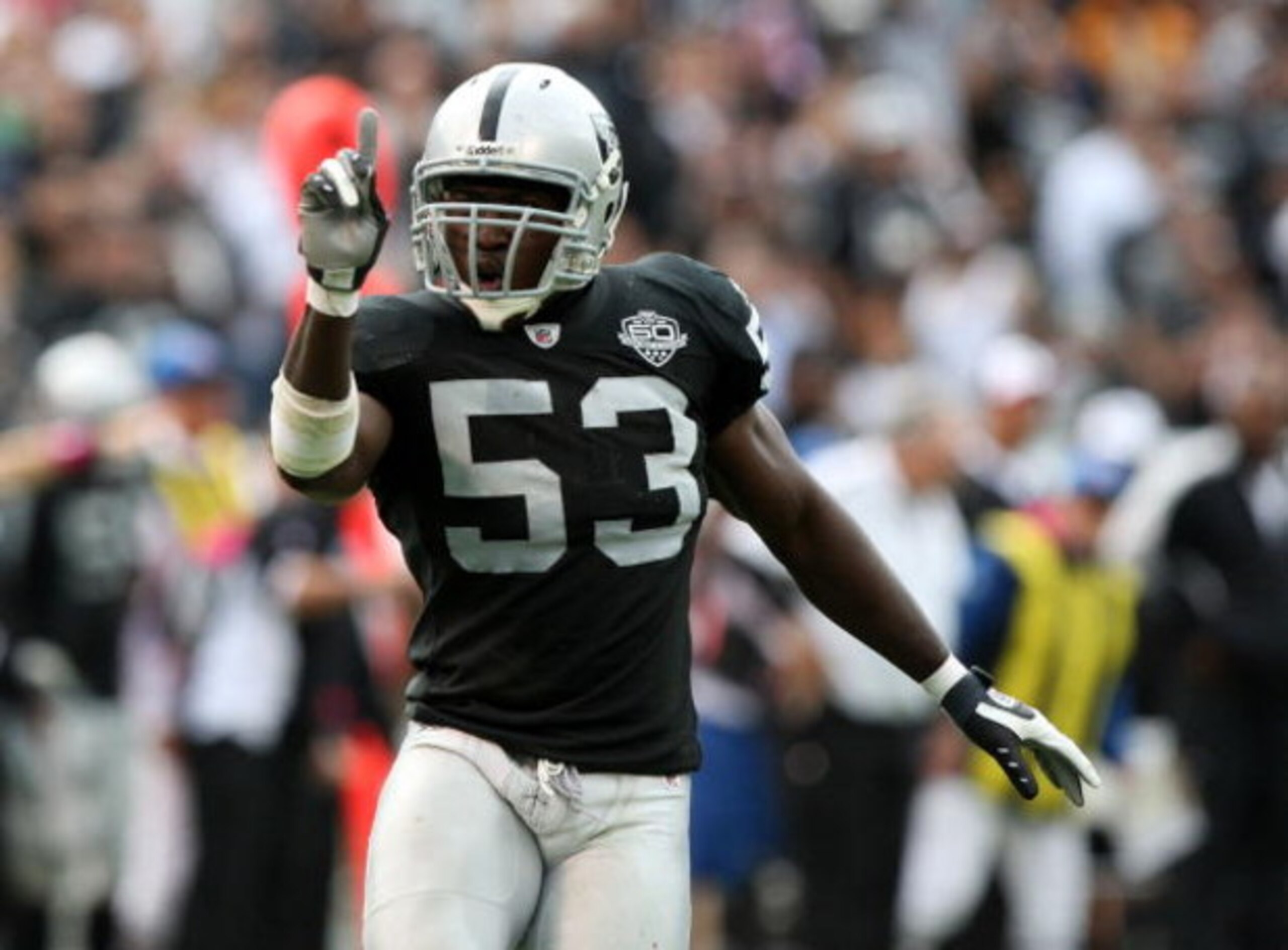 OAKLAND, CA - OCTOBER 18: Thomas Howard #53 of the Oakland Raiders celebrates after a play against the Philadelphia Eagles during an NFL game at the Oakland-Alameda County Coliseum on October 18, 2009 in Oakland, California. (Photo by Jed Jacobsohn/Gett OAKLAND, CA - OCTOBER 18: Thomas Howard #53 of the Oakland Raiders celebrates after a play against the Philadelphia Eagles during an NFL game at the Oakland-Alameda County Coliseum on October 18, 2009 in Oakland, California. (Photo by Jed Jacobsohn/Gett