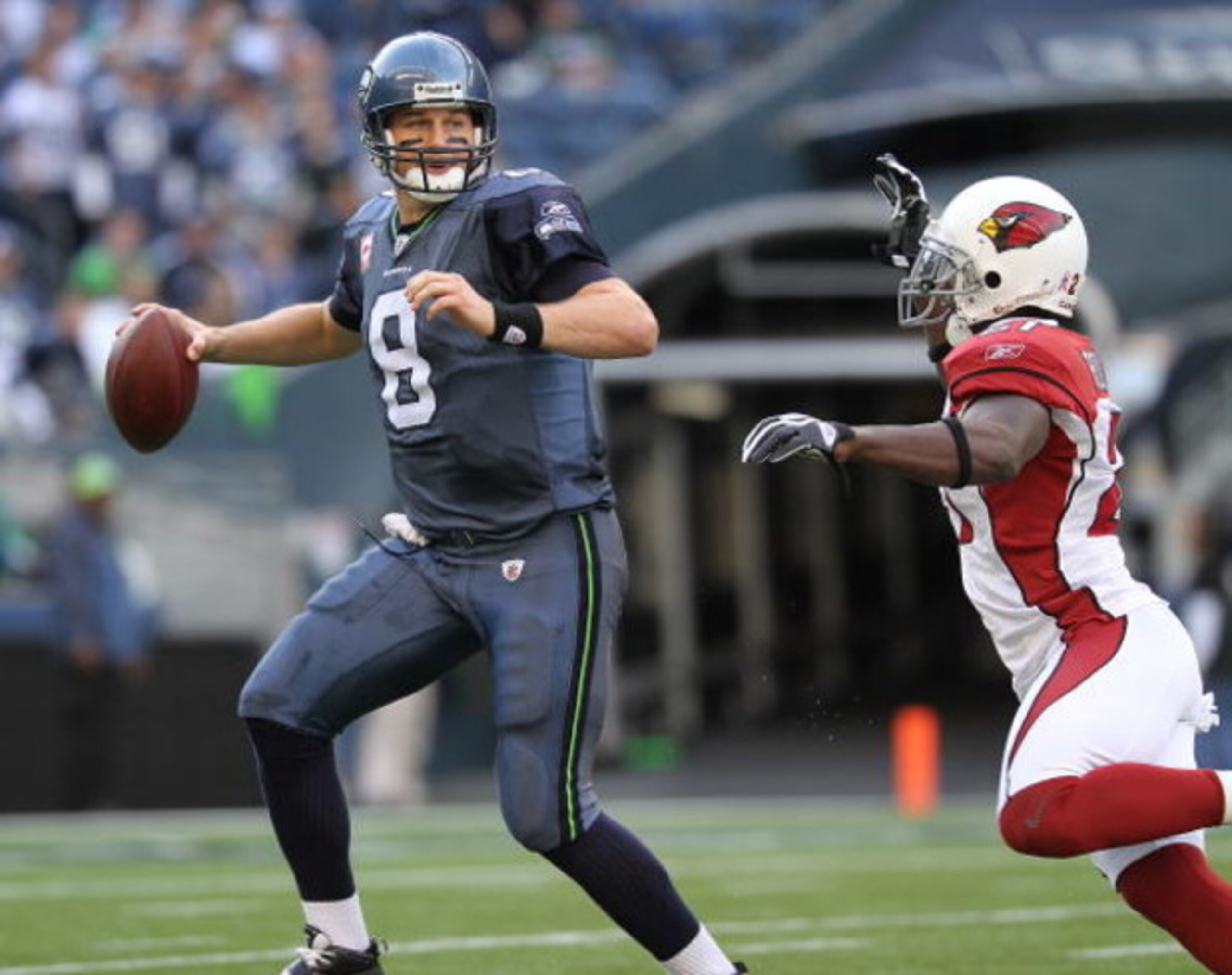 SEATTLE - OCTOBER 18: Quarterback Matt Hasselbeck #8 of the Seattle Seahawks scrambles against Antrel Rolle #21 of the Arizona Cardinals on October 18, 2009 at Qwest Field in Seattle, Washington. The Cardinals defeated the Seahawks 27-3. (Photo by Otto Gr SEATTLE - OCTOBER 18: Quarterback Matt Hasselbeck #8 of the Seattle Seahawks scrambles against Antrel Rolle #21 of the Arizona Cardinals on October 18, 2009 at Qwest Field in Seattle, Washington. The Cardinals defeated the Seahawks 27-3. (Photo by Otto Gr