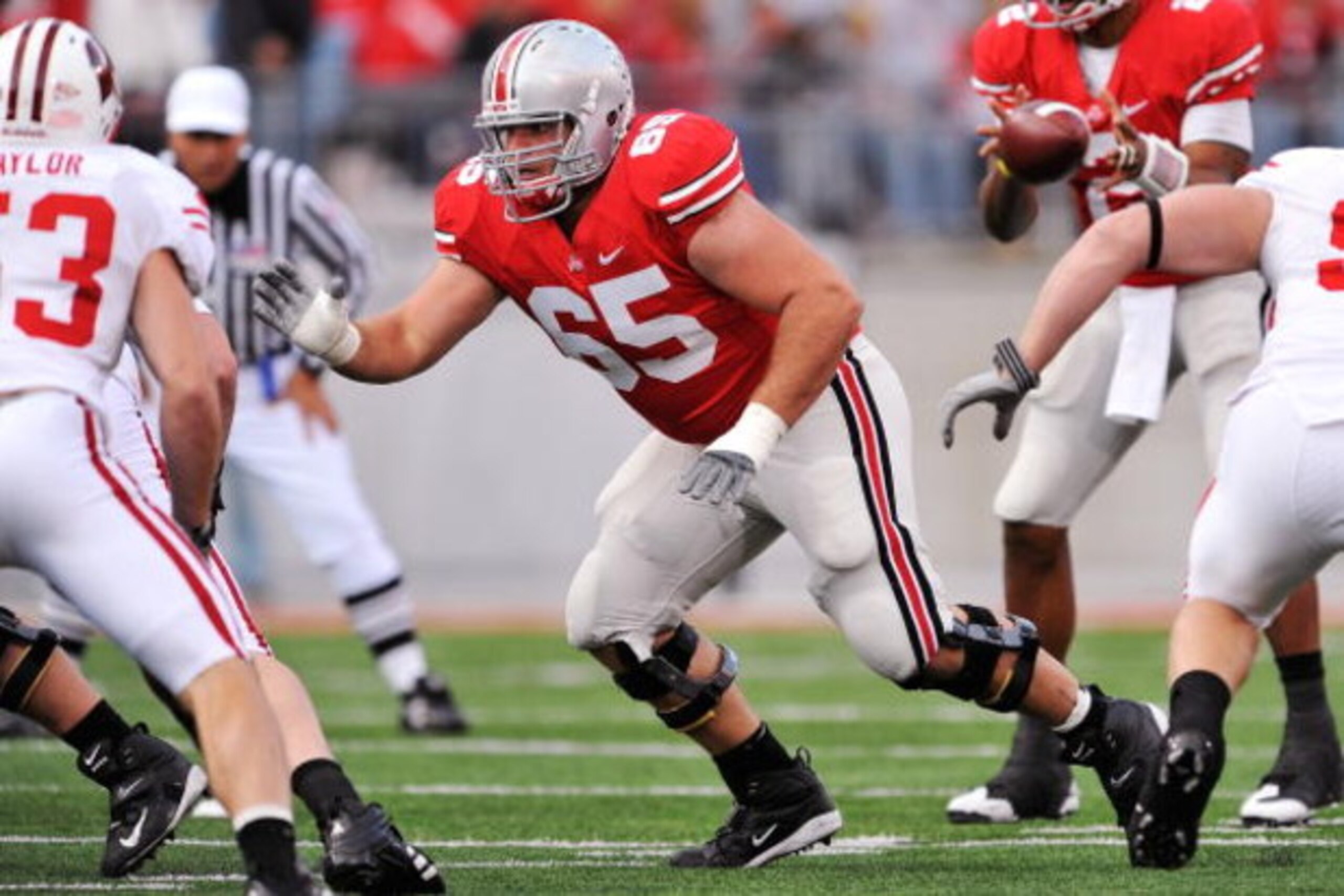 COLUMBUS, OH - OCTOBER 10:  Offensive Lineman Justin Boren #65 of the Ohio State Buckeyes blocks against the Wisconsin Badgers at Ohio Stadium on October 10, 2009 in Columbus, Ohio.  (Photo by Jamie Sabau/Getty Images)