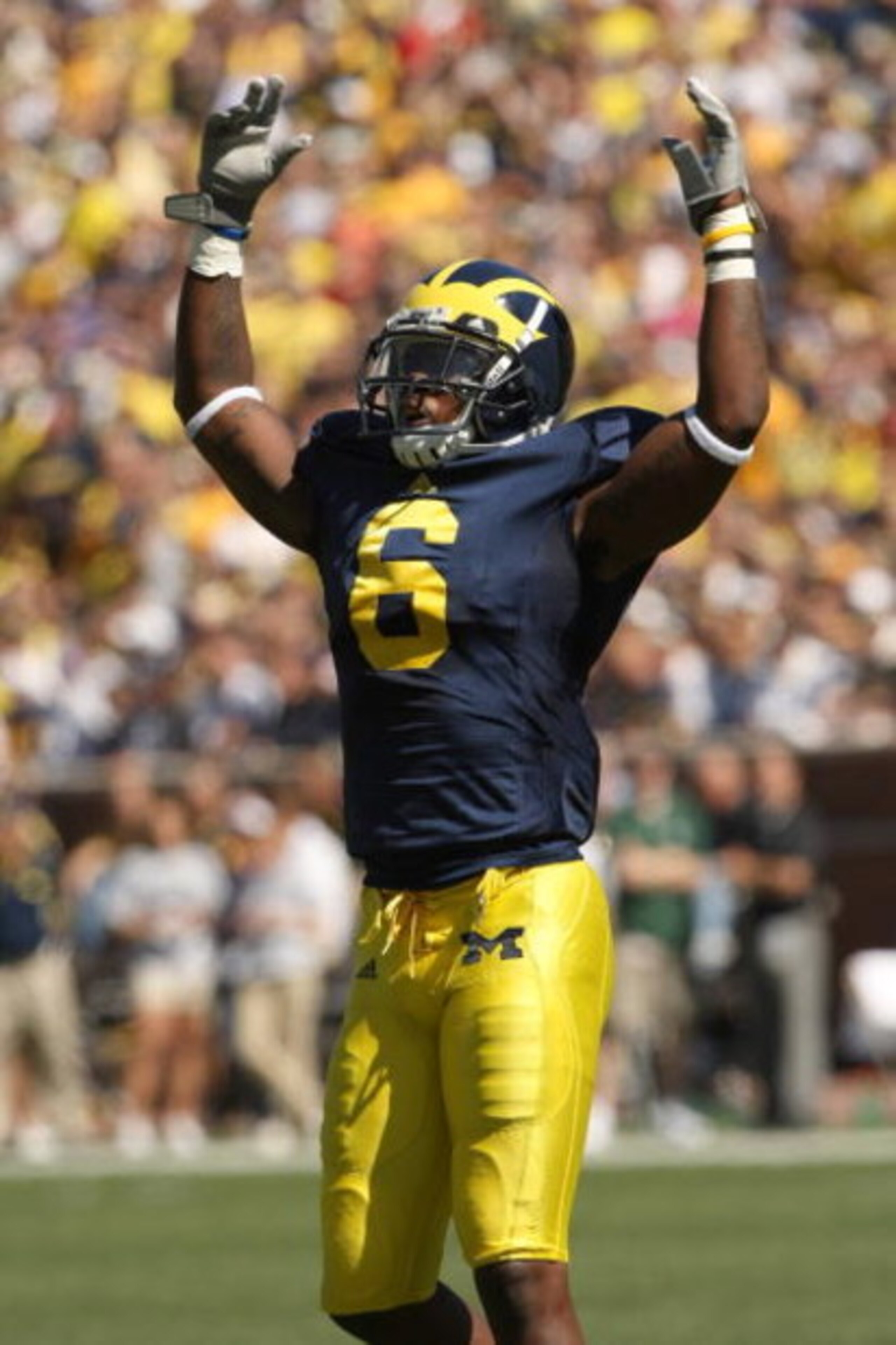 ANN ARBOR, MI - SEPTEMBER 19:  Cornerback Donovan Warren #6 of the Michigan Wolverines exhorts the crowd in the game with the Eastern Michigan Eagles at Michigan Stadium on September 19, 2009 in Ann Arbor, Michigan.  Michigan won 45-17.  (Photo by Stephen