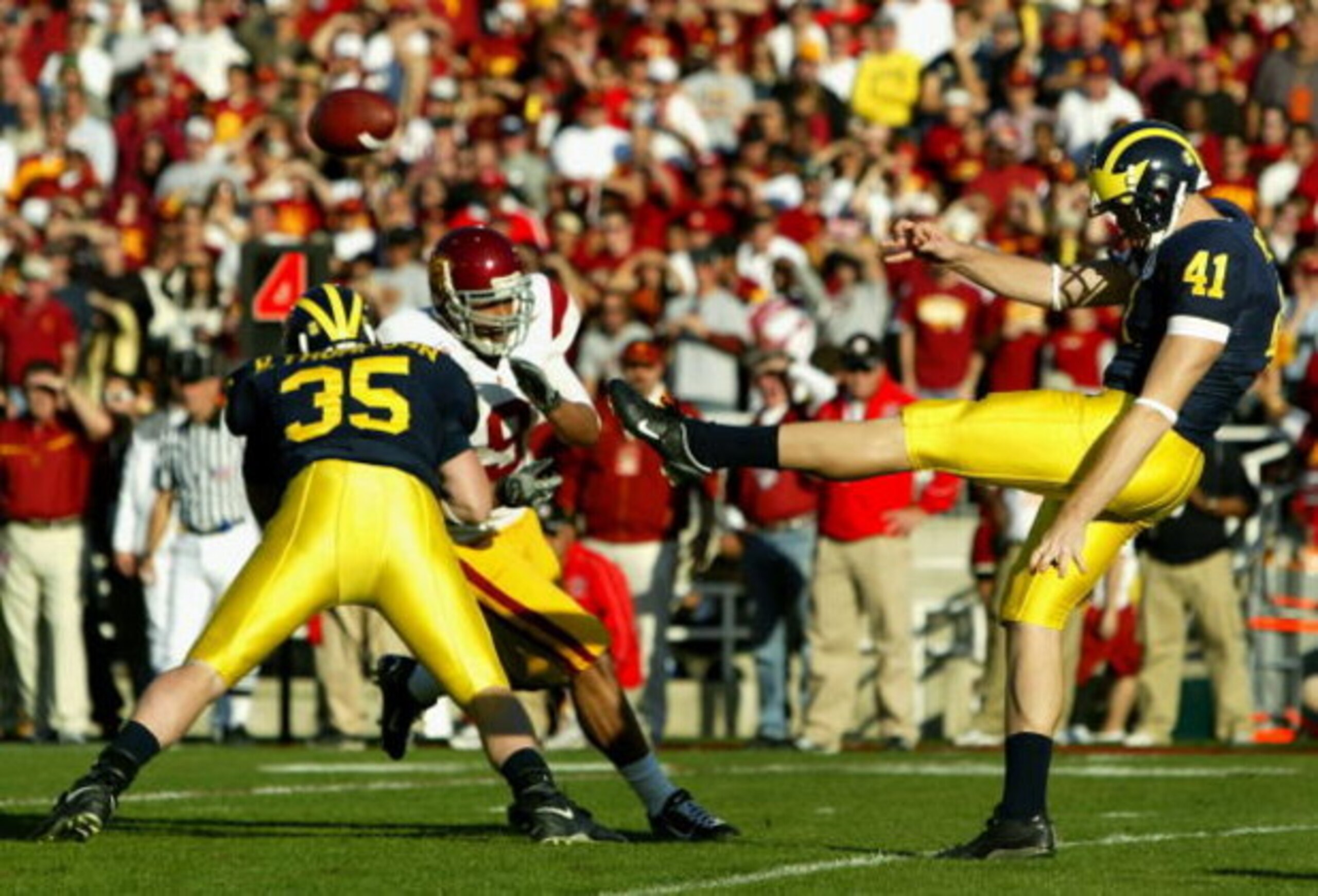 PASADENA, CA - JANUARY 01:  Punter Zoltan Mesko #41 of the Michigan Wolverines punts the ball against the USC Trojans during the Rose Bowl game on January 1, 2007 at the Rose Bowl in Pasadena, California. The Trojans defeated the Wolverines 32-18.  (Photo