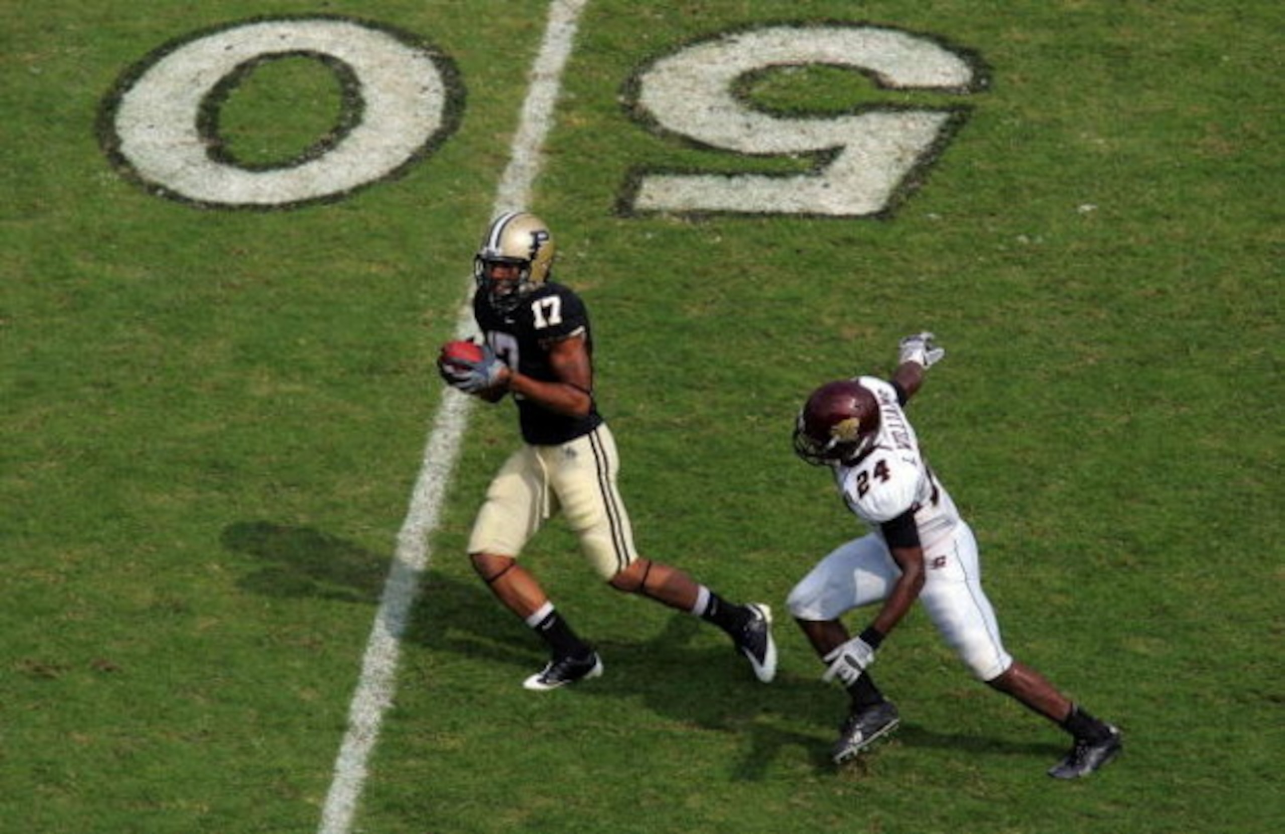 WEST LAFAYETTE, IN - SEPTEMBER 20: Wide receiver Aaron Valentin #17 of the Purdue Boilermakers makes a pass reception against LaVarus Williams #24 of the Central Michigan Chippewas at Ross-Ade Stadium on September 20, 2008 in West Lafayette, Indiana.  (Ph