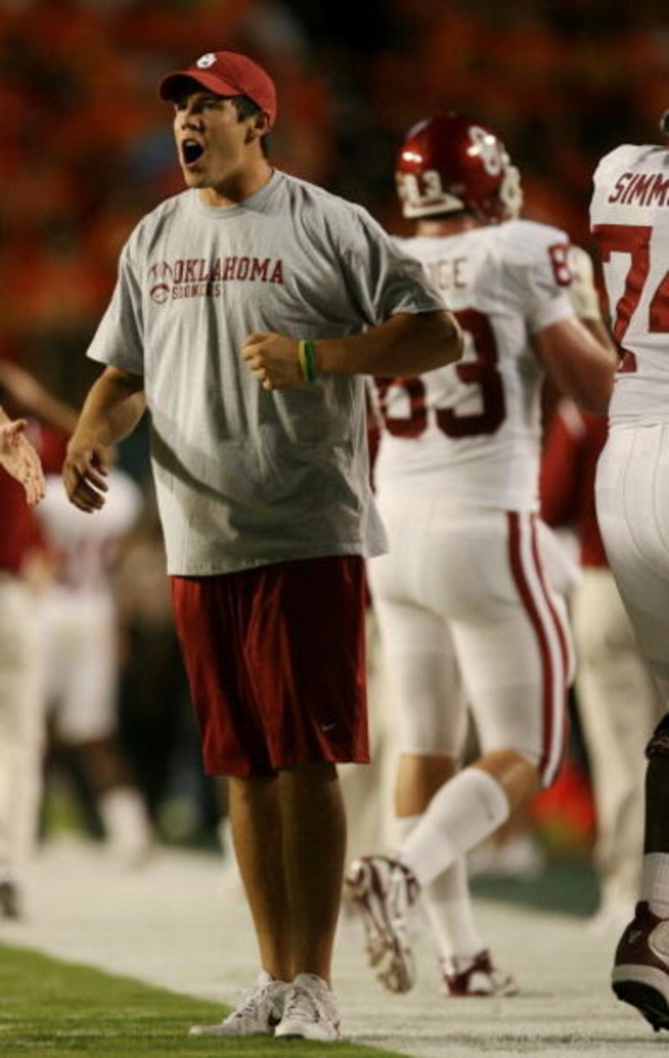 MIAMI GARDENS, FL - OCTOBER 3:  Quarterback Sam Bradford of the Oklahoma Sooners celebrates the touchdown scored by teammate Cameron Kenney #6 in the first quarter of the game against the Miami Hurricanes on October 3, 2009 at Landshark Stadium in Miami G