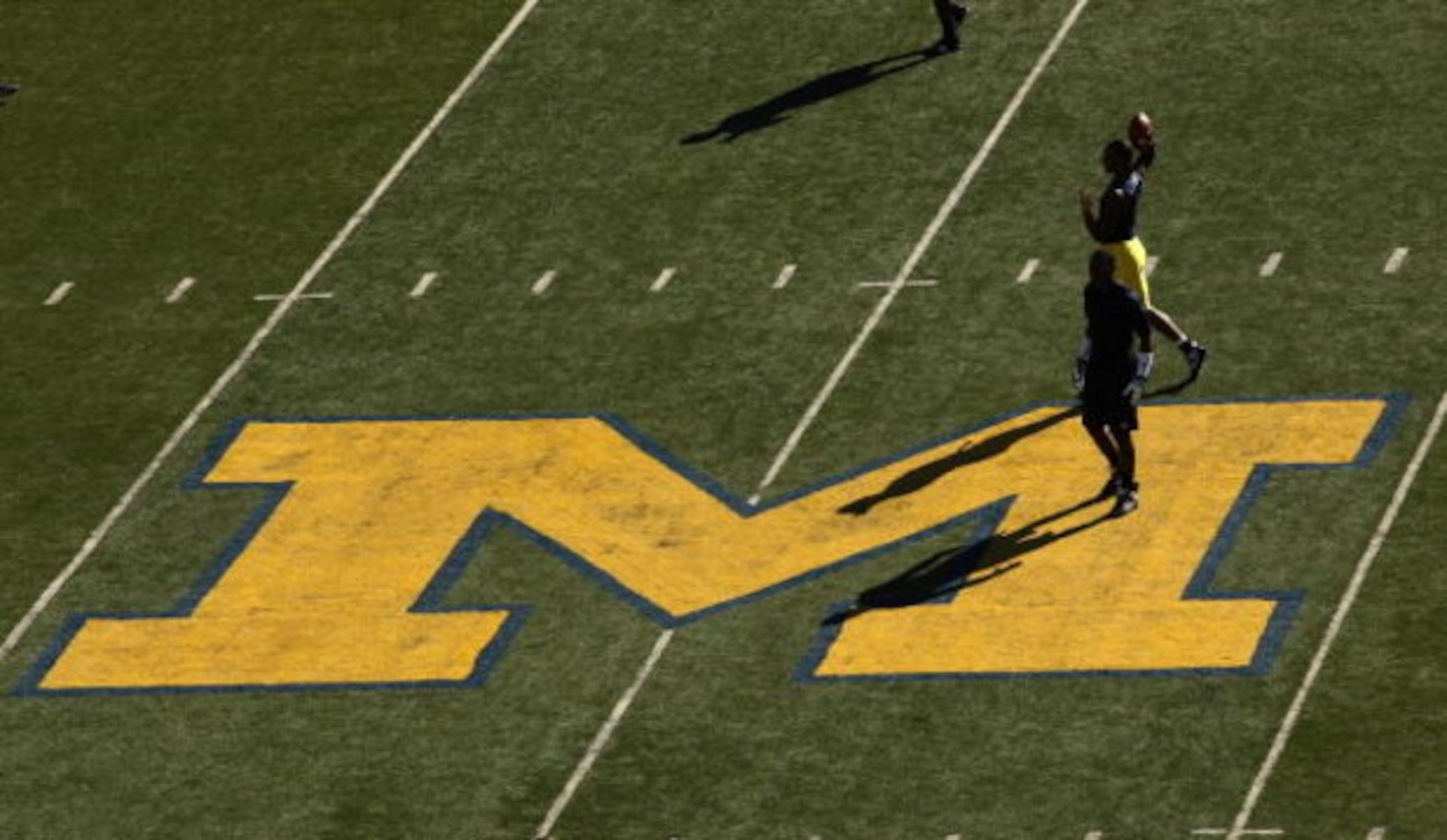 ANN ARBOR, MI - SEPTEMBER 19:  Michigan Wolverines players warm up for their game with the Eastern Michigan Eagles at Michigan Stadium on September 19, 2009 in Ann Arbor, Michigan.  (Photo by Stephen Dunn/Getty Images)