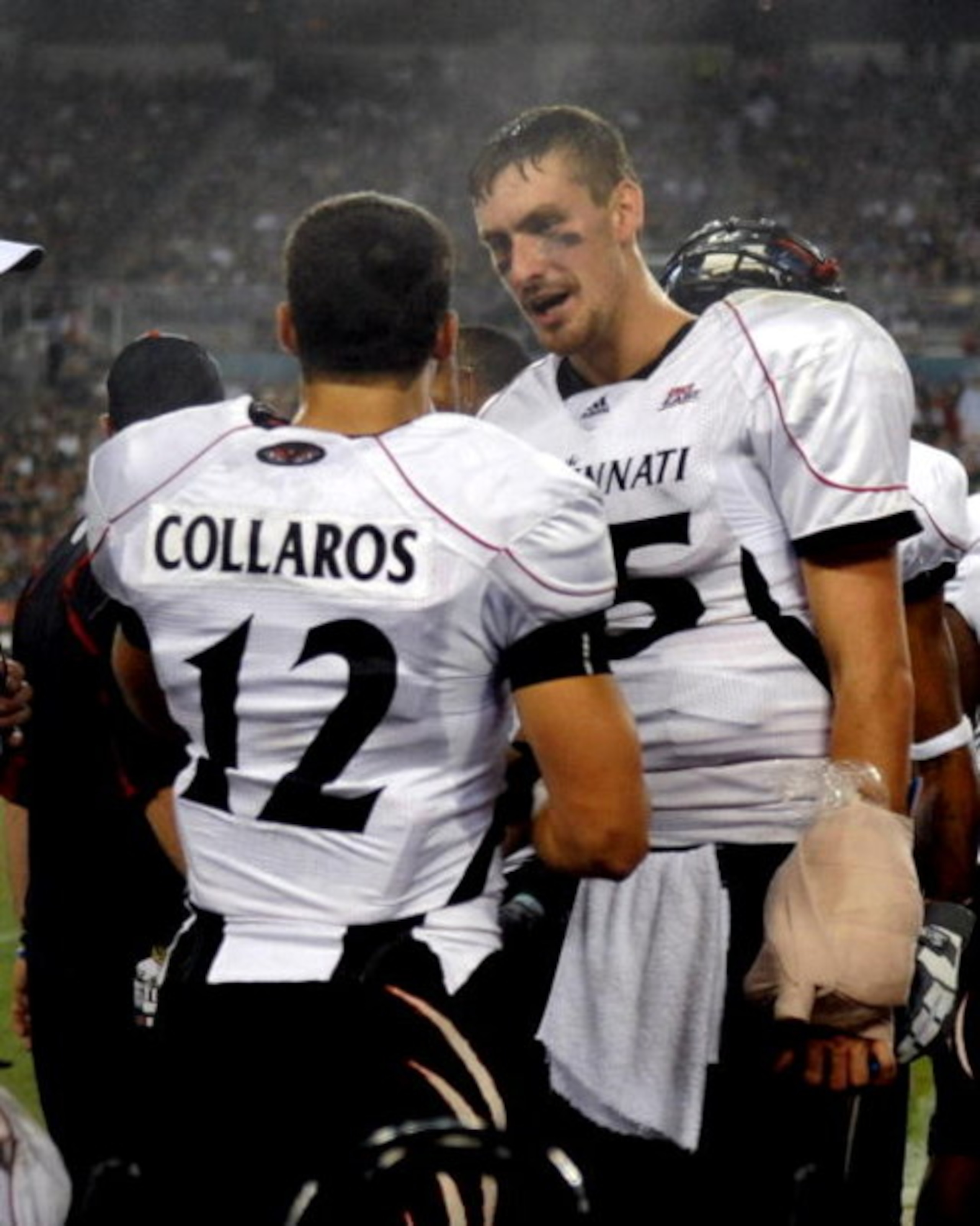 TAMPA, FL - OCTOBER 15: Quarterback Zach Collaros #12 of the Cincinnati Bearcats talks with injured quarterback Tony Pike #15 during play against the University of South Florida Bulls October 15, 2009 at Raymond James Stadium in Tampa, Florida.  (Photo by