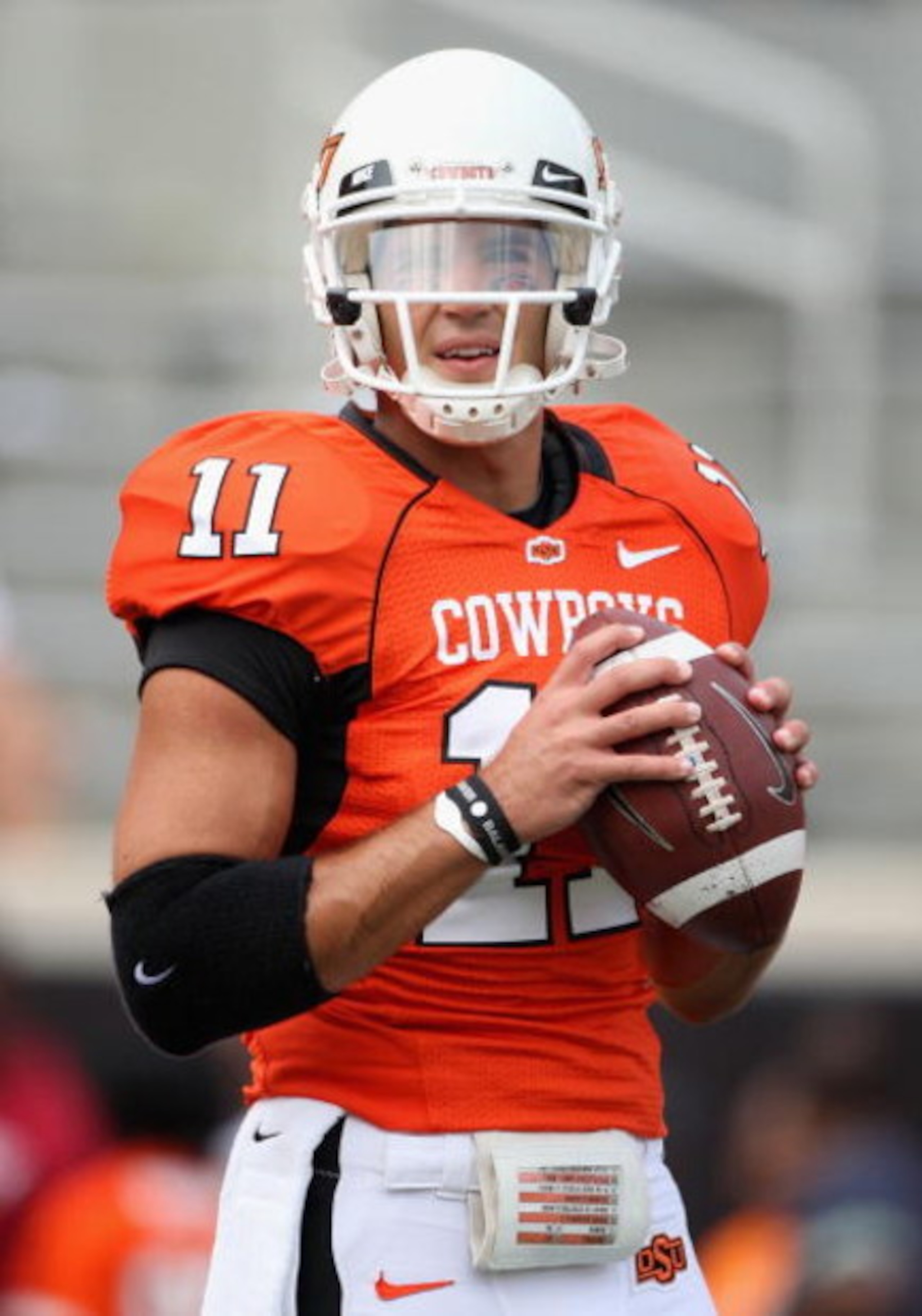 STILLWATER, OK - SEPTEMBER 05: Quarterback Zac Robinson #11 of the Oklahoma State Cowboys warms up before the college football game against the Georgia Bulldogs at Boone Pickens Stadium on September 5, 2009 in Stillwater, Oklahoma. The Cowboys defeated STILLWATER, OK - SEPTEMBER 05: Quarterback Zac Robinson #11 of the Oklahoma State Cowboys warms up before the college football game against the Georgia Bulldogs at Boone Pickens Stadium on September 5, 2009 in Stillwater, Oklahoma. The Cowboys defeated
